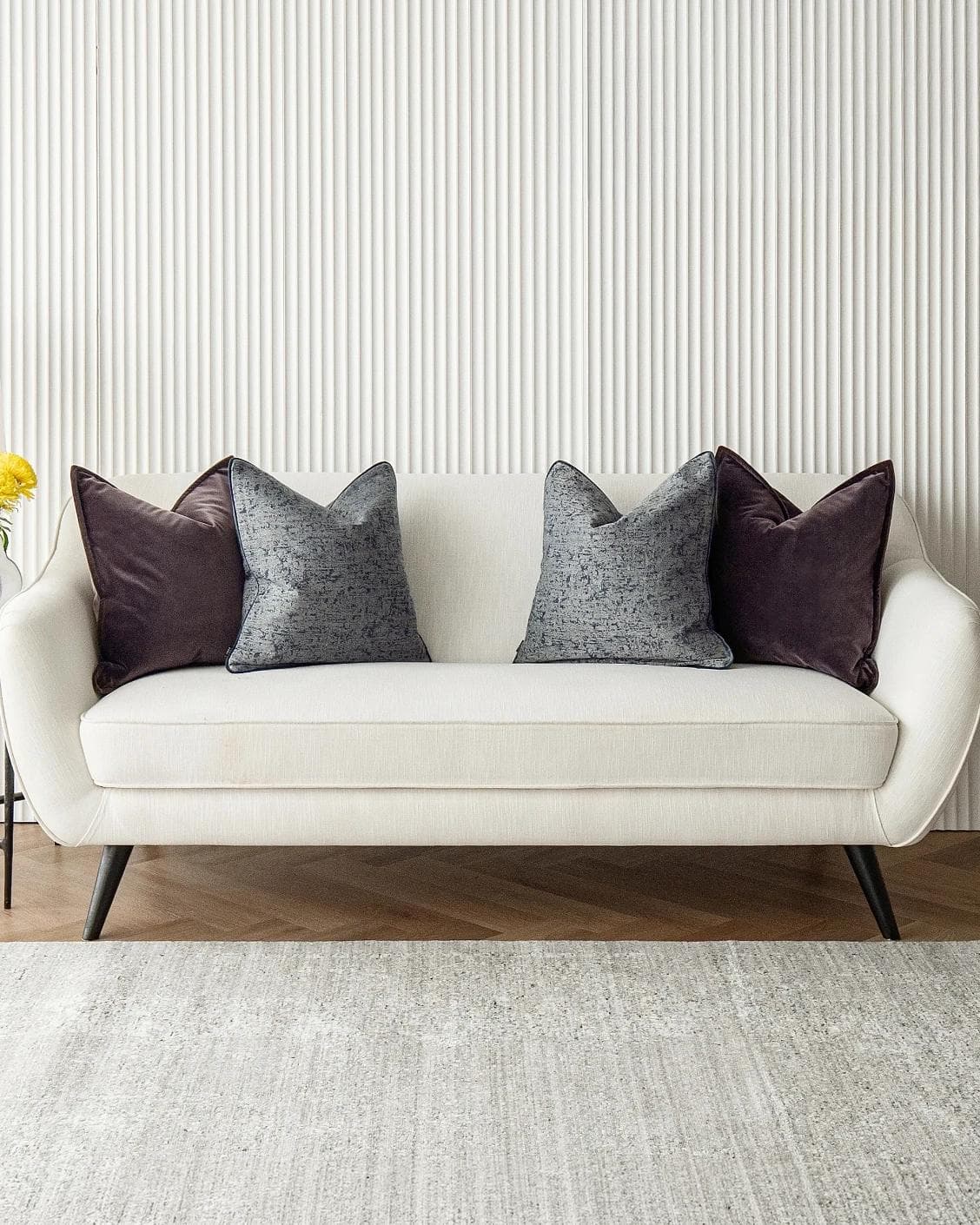 Lolanthe Bundle cushion in blue and purple, shown in a lifestyle front view as image 2