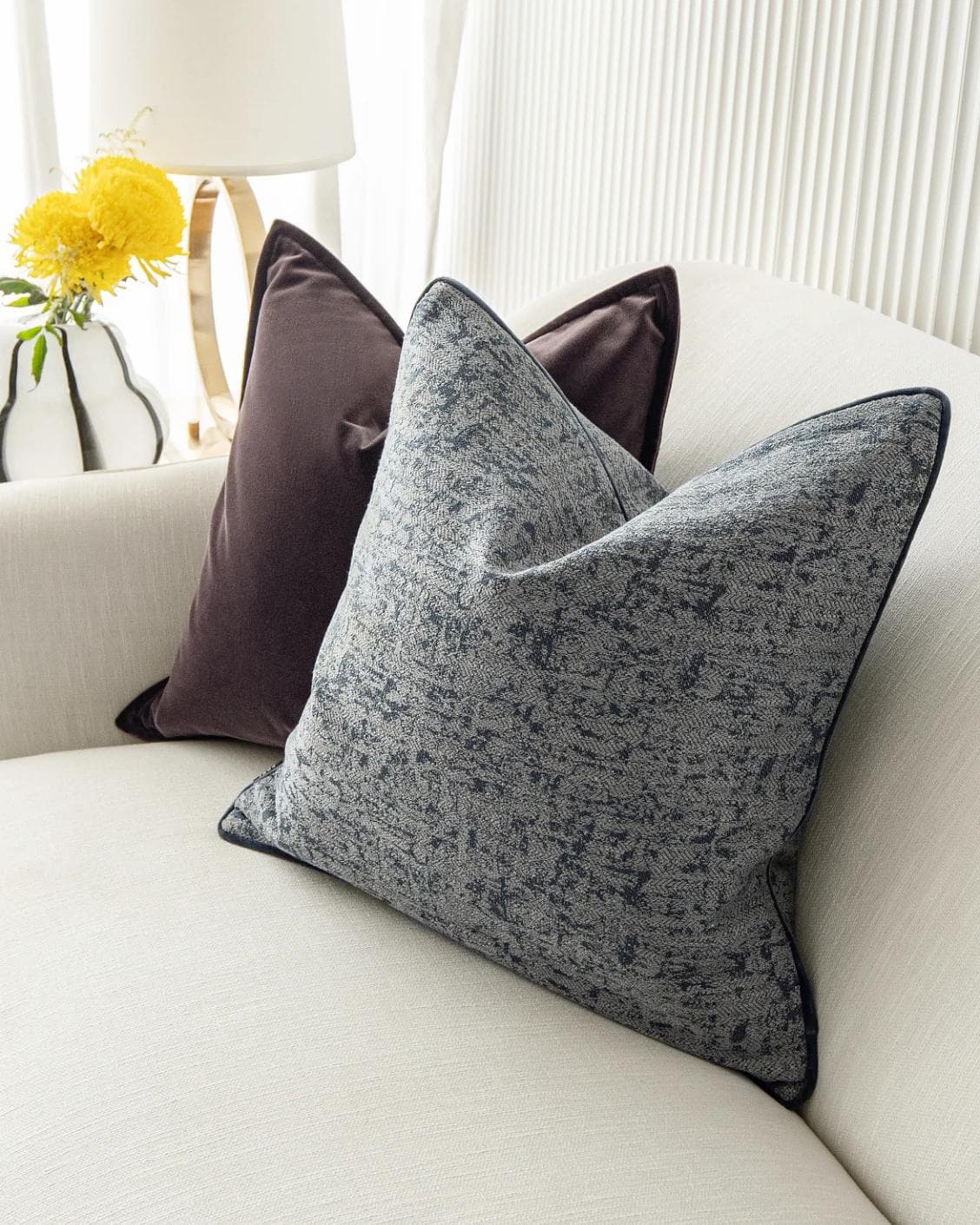 Lolanthe Bundle cushion in blue and purple, shown in a lifestyle top view as image 6