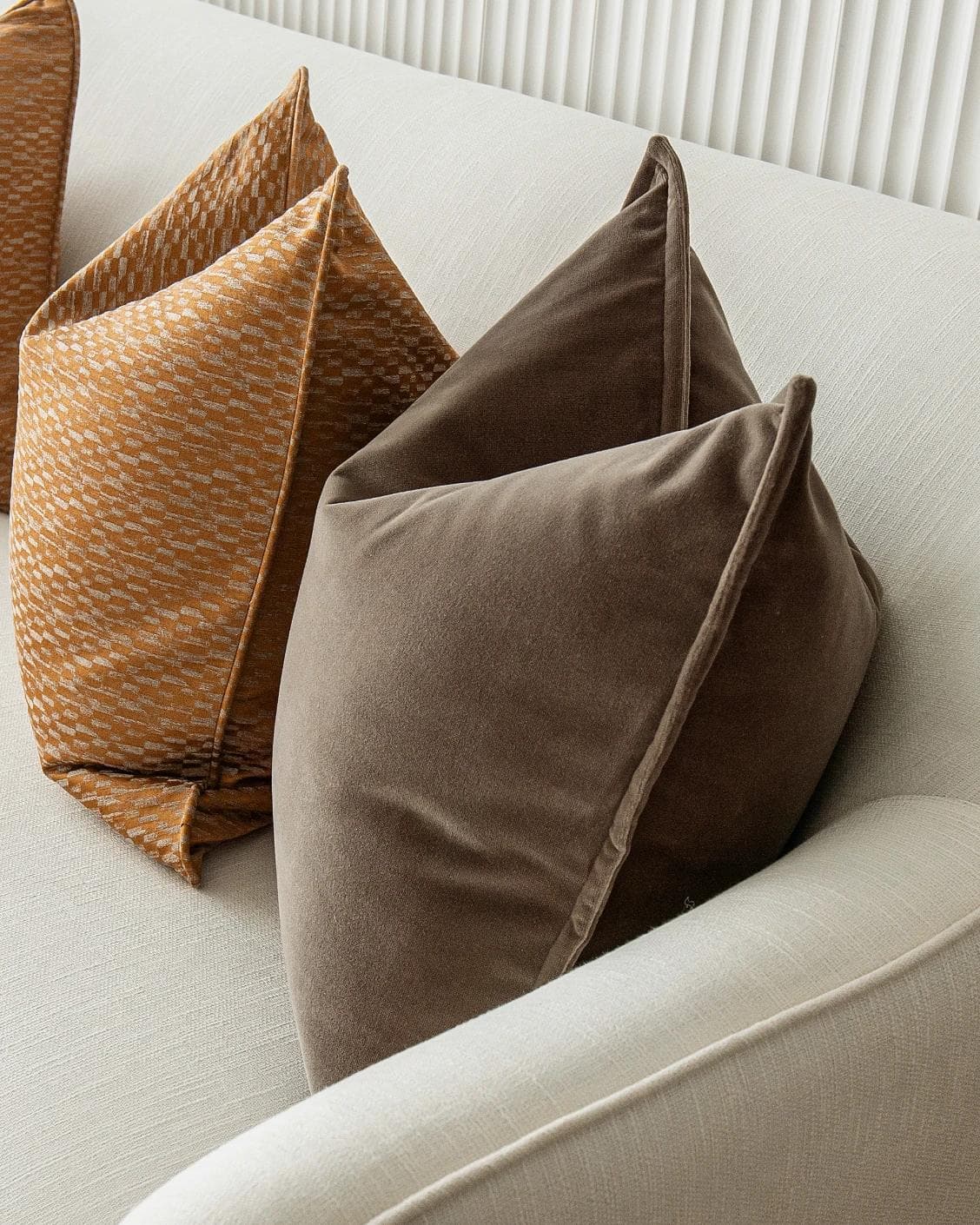 Jora Bundle cushion in brown and orange, shown in a product right view as image 7