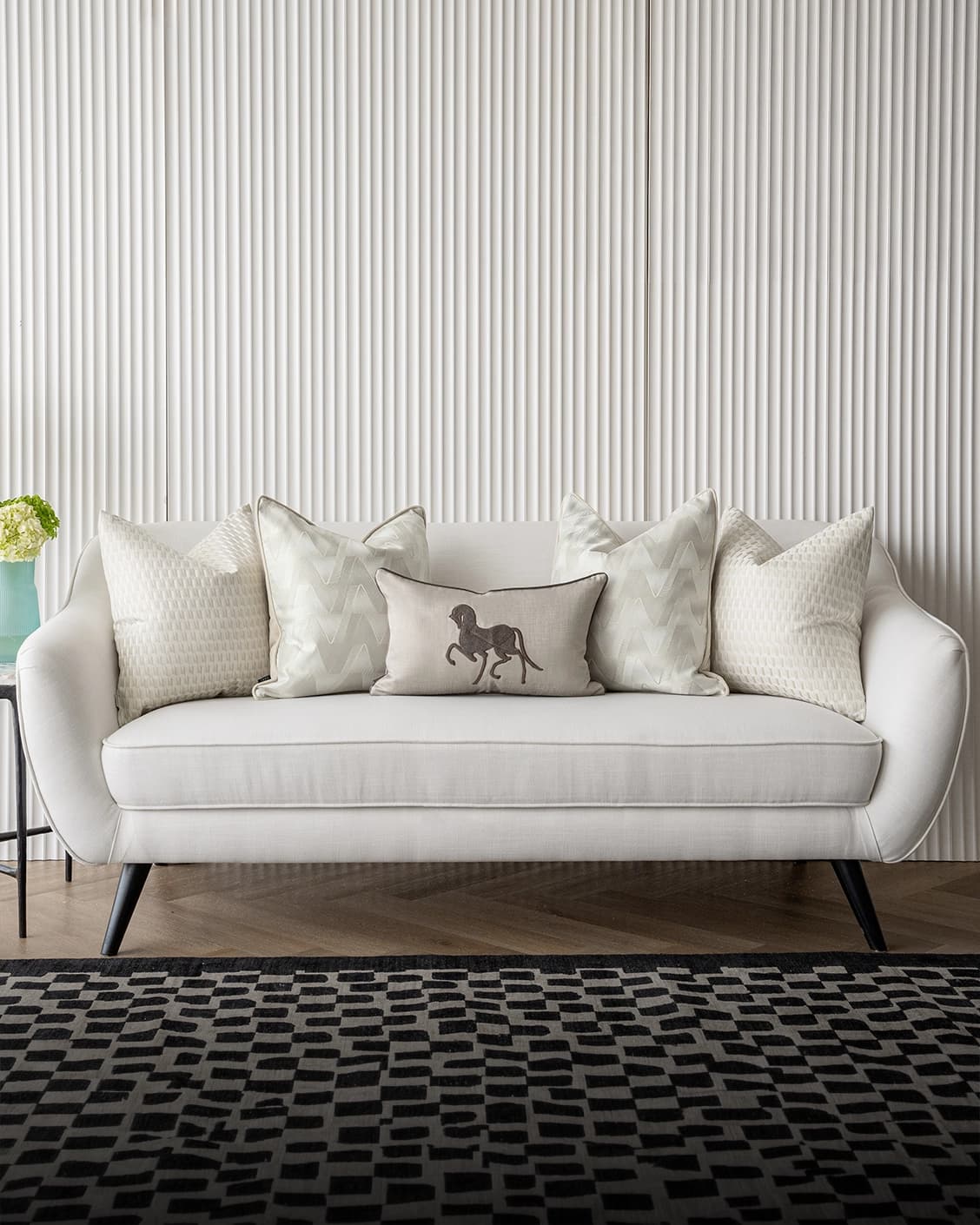 Vaani Bundle cushion in brown, beige, silver and white, shown in a lifestyle front view as image 4
