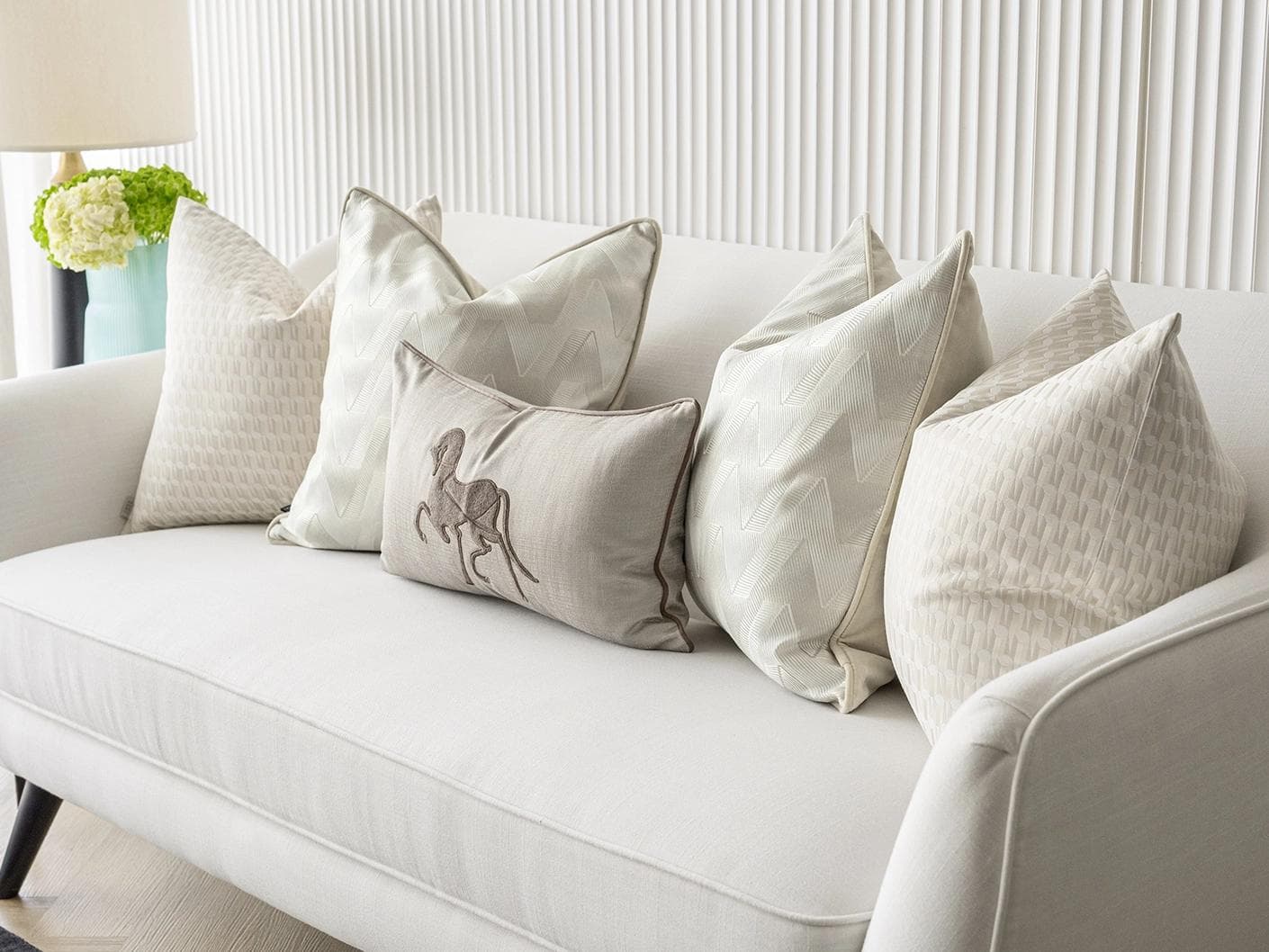 Vaani Bundle cushion in brown, beige, silver and white, shown in a lifestyle right view as image 5