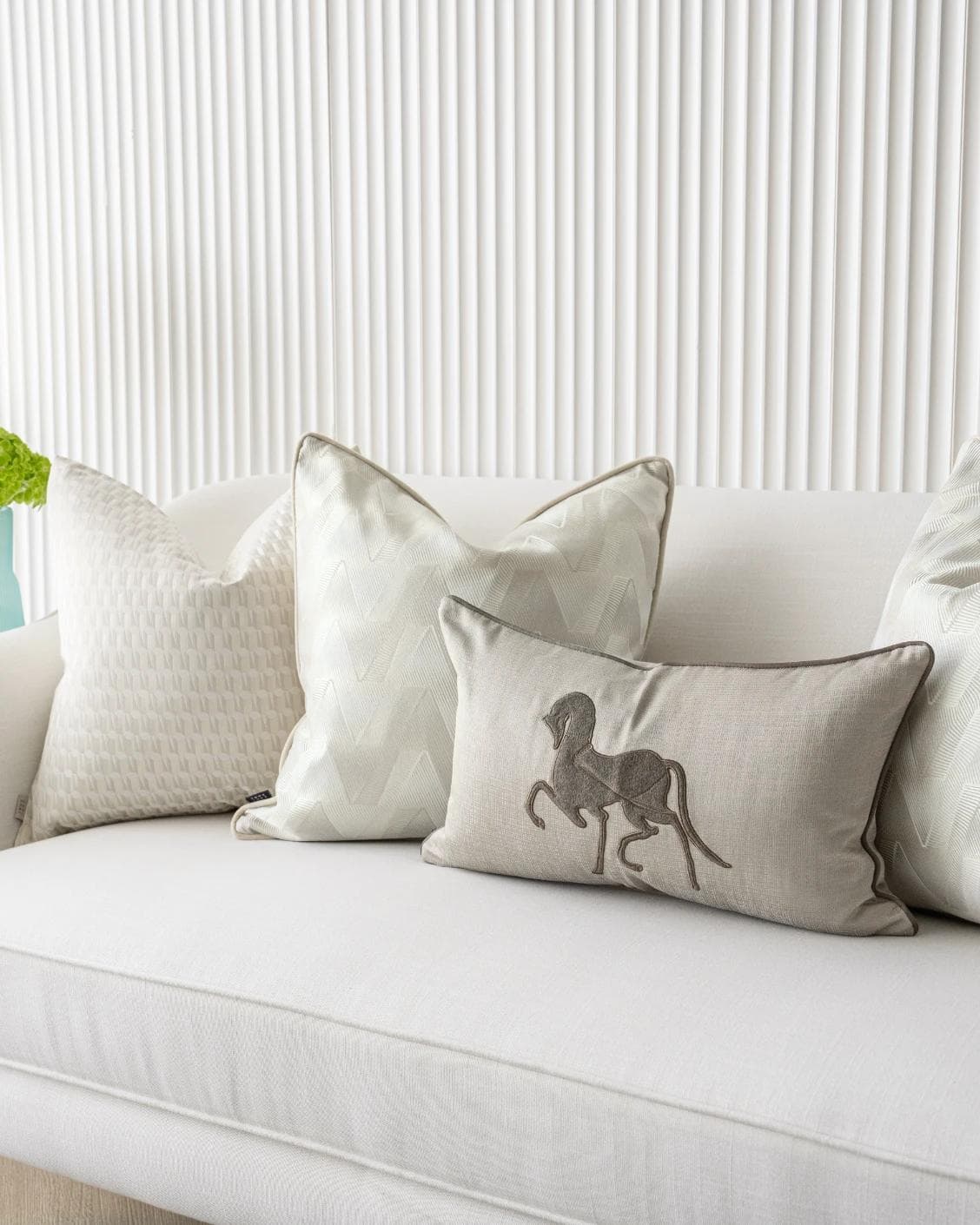 Vaani Bundle cushion in brown, beige, silver and white, shown in a lifestyle right view as image 6