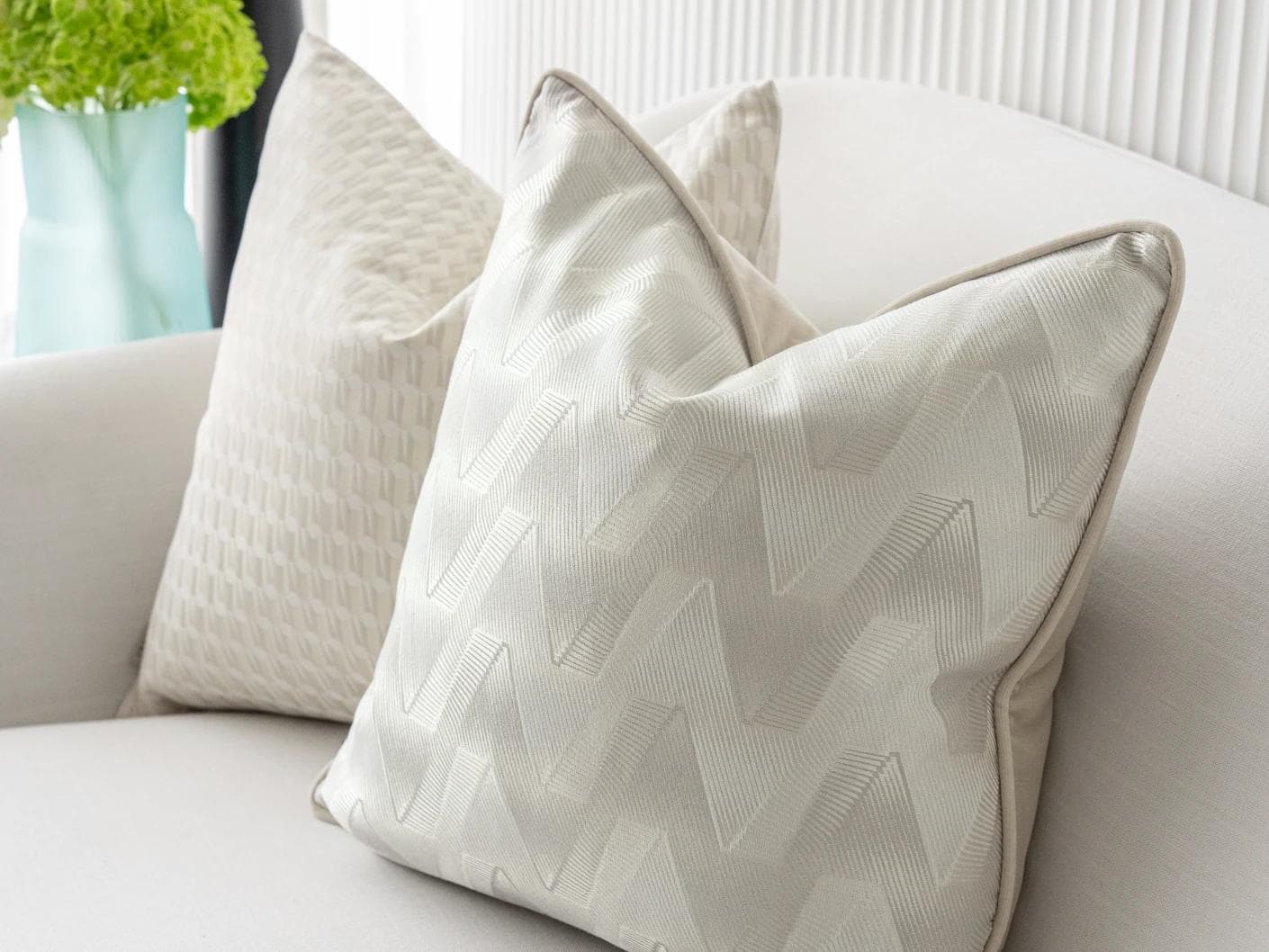 Vaani Bundle cushion in brown, beige, silver and white, shown in a lifestyle right view as image 7