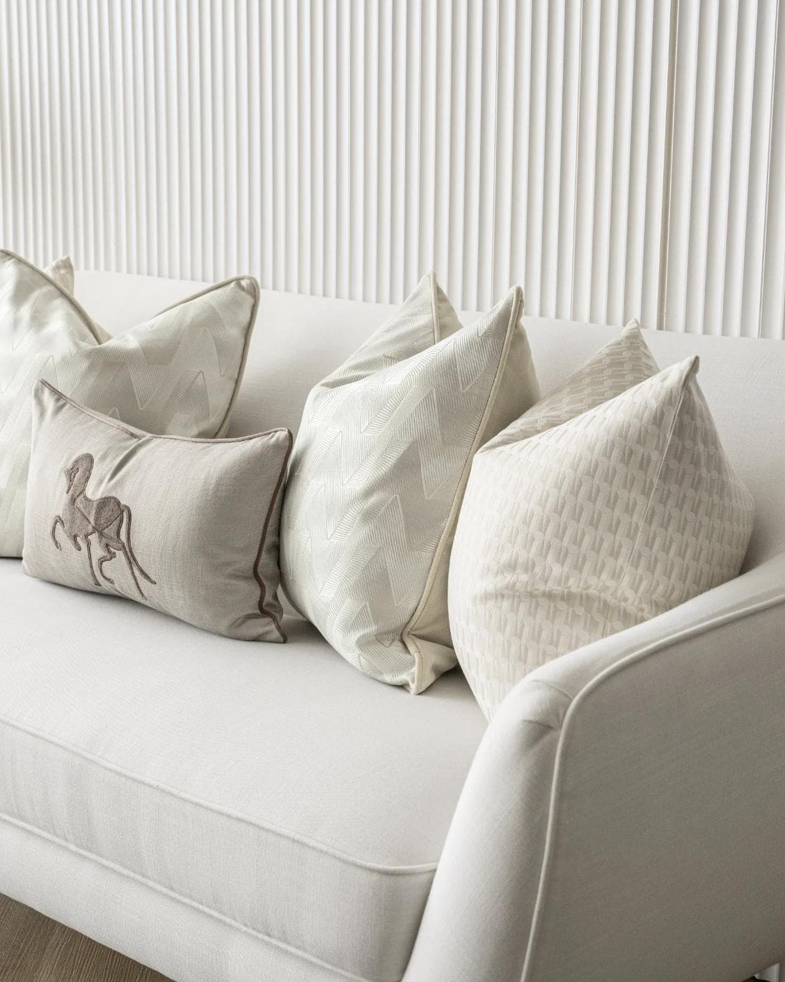 Vaani Bundle cushion in brown, beige, silver and white, shown in a lifestyle right view as image 5