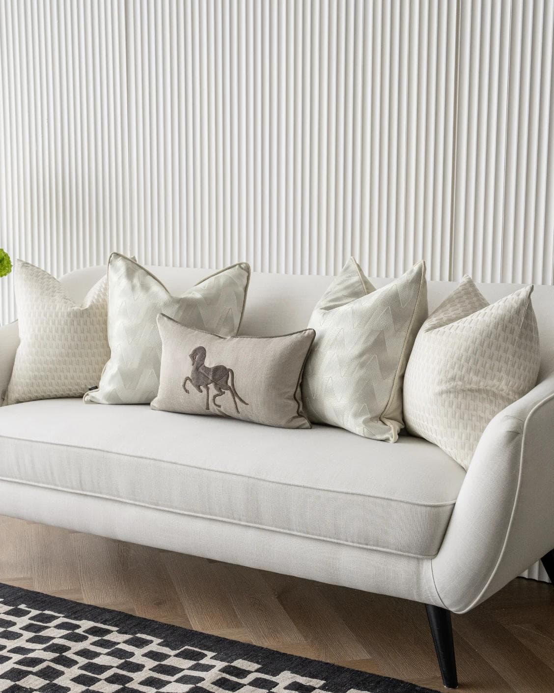 Vaani Bundle cushion in brown, beige, silver and white, shown in a lifestyle right view as image 2