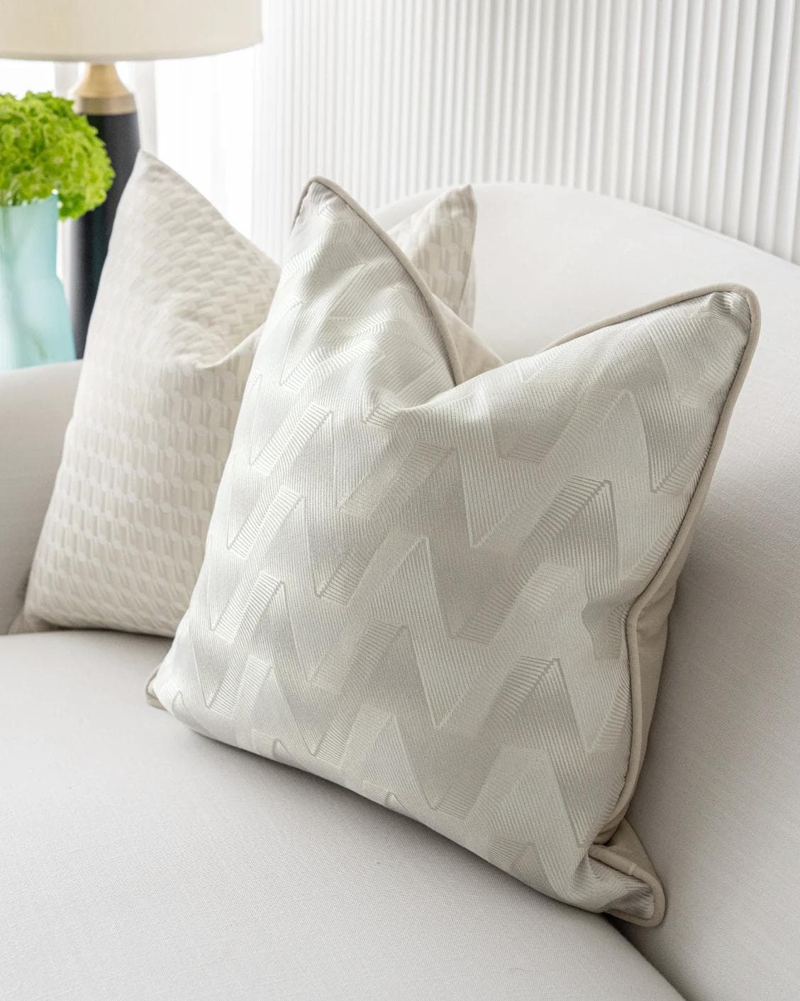 Vaani Bundle cushion in brown, beige, silver and white, shown in a lifestyle right view as image 7