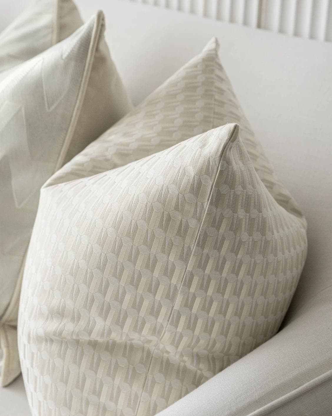 Vaani Bundle cushion in brown, beige, silver and white, shown in a product right view as image 8