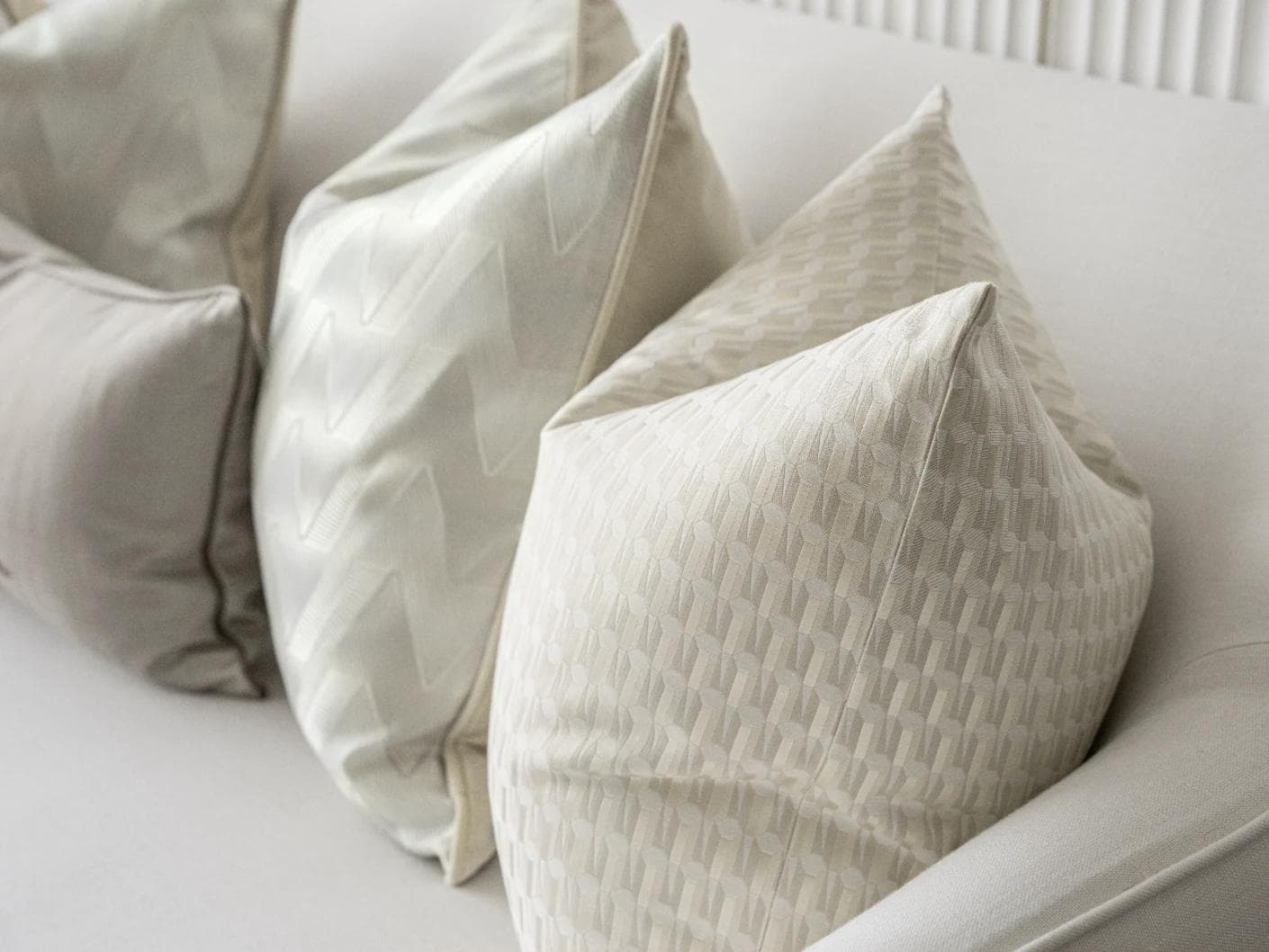Vaani Bundle cushion in brown, beige, silver and white, shown in a product right view as image 8