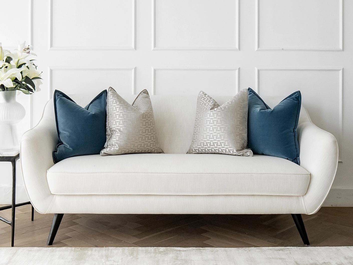 Myra Bundle cushion in blue, beige and silver, shown in a lifestyle front view as image 4