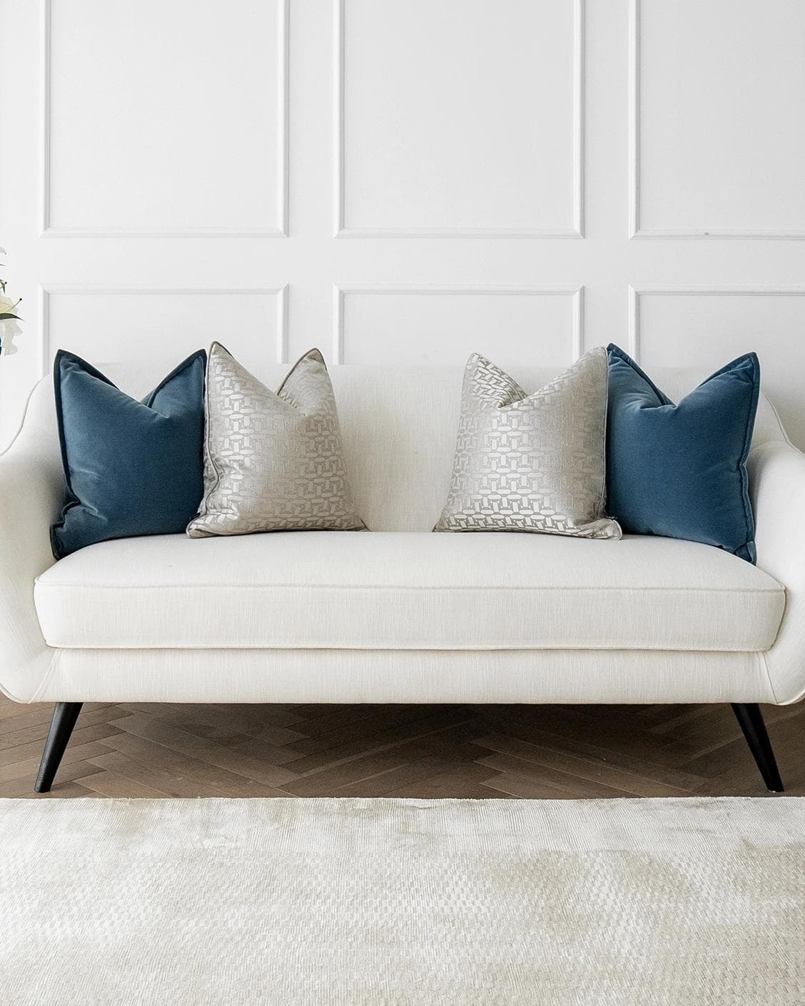 Myra Bundle cushion in blue, beige and silver, shown in a lifestyle front view as image 4