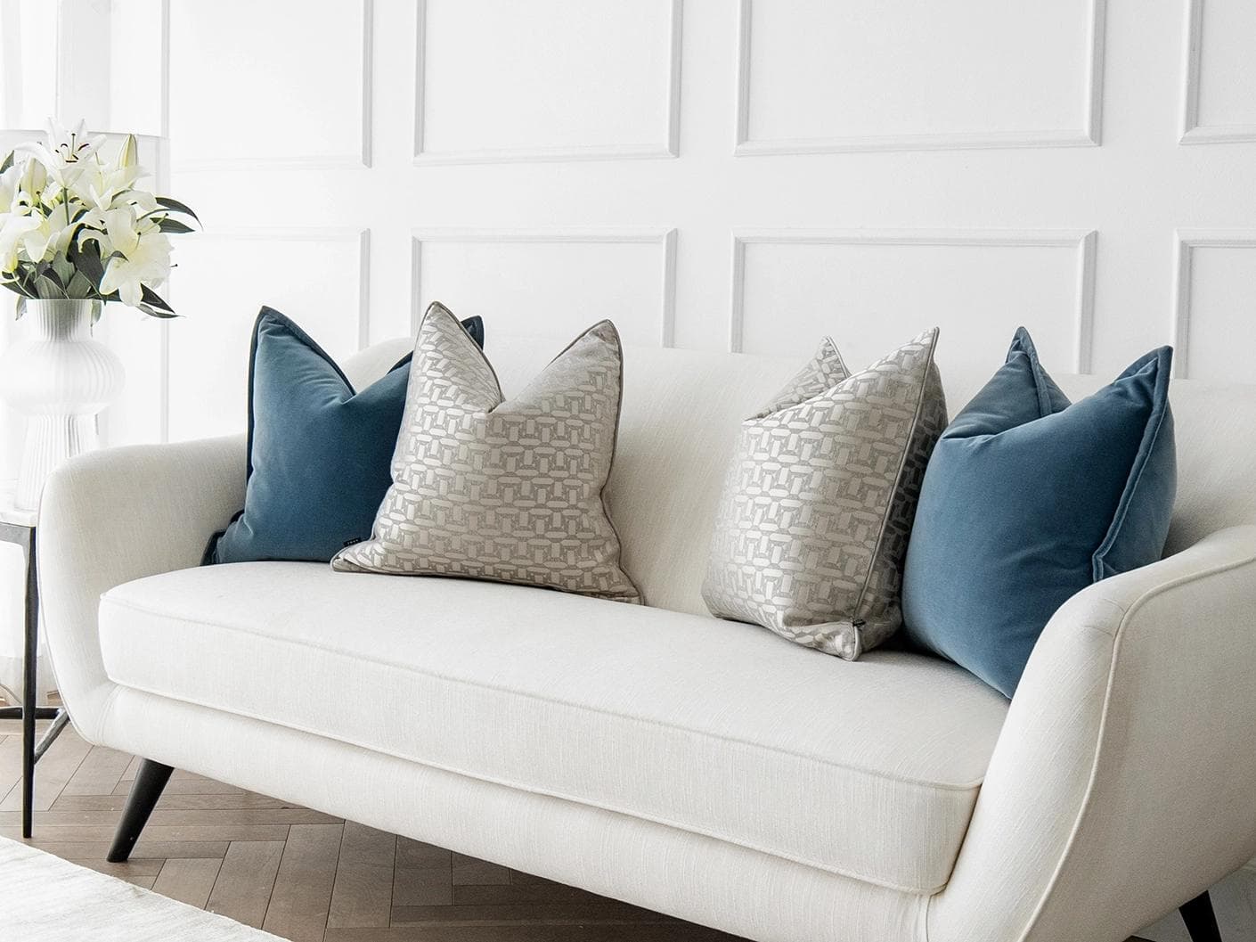 Myra Bundle cushion in blue, beige and silver, shown in a lifestyle right view as image 2