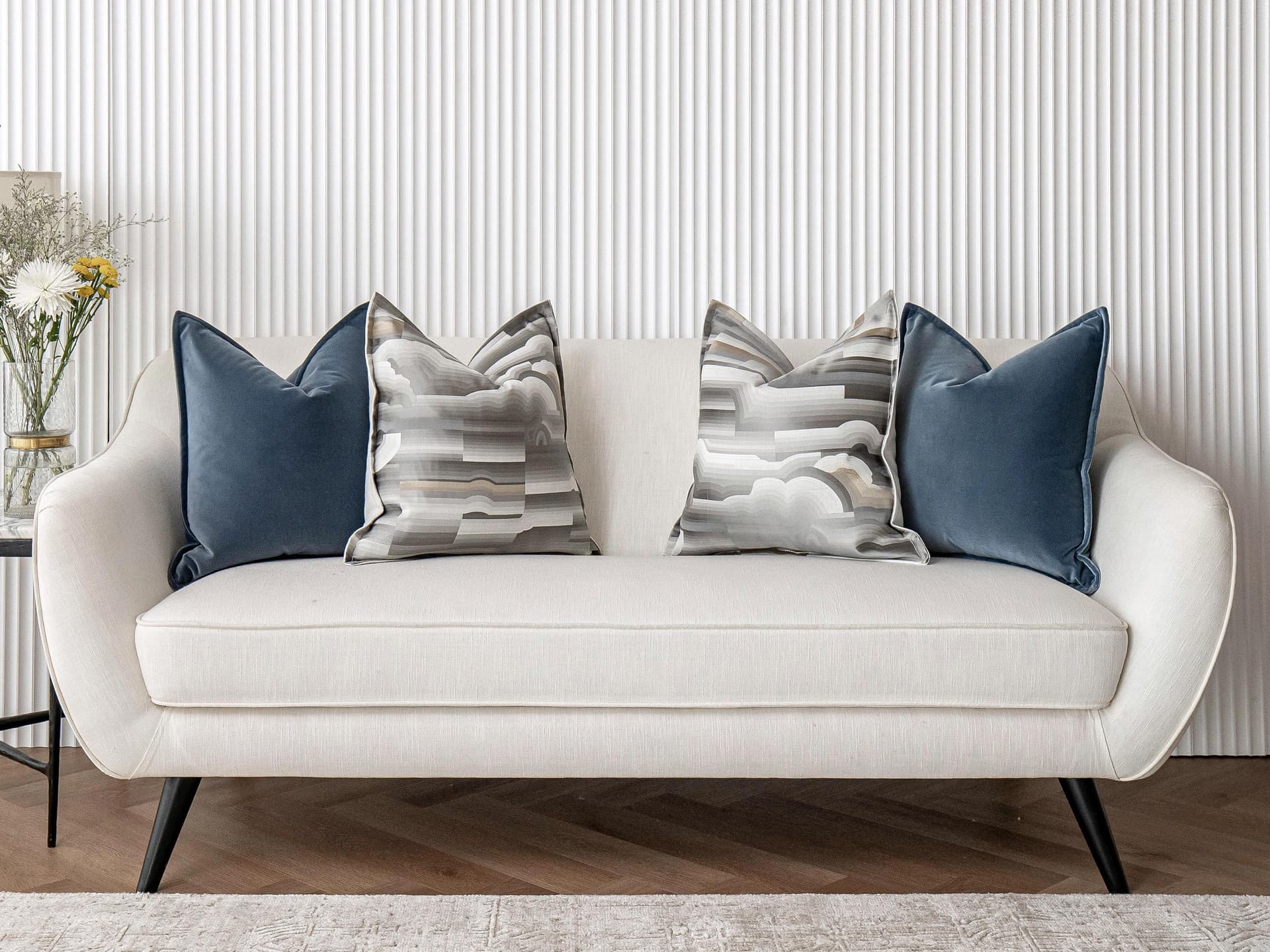 Guadalupe Bundle cushion in blue and grey, shown in a lifestyle front view as image 8