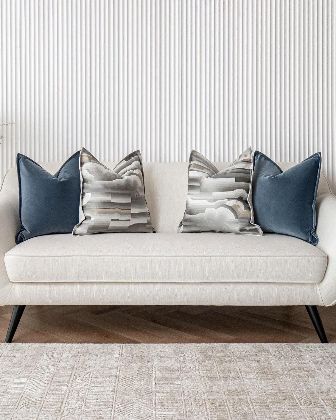 Guadalupe Bundle cushion in blue and grey, shown in a lifestyle front view as image 8