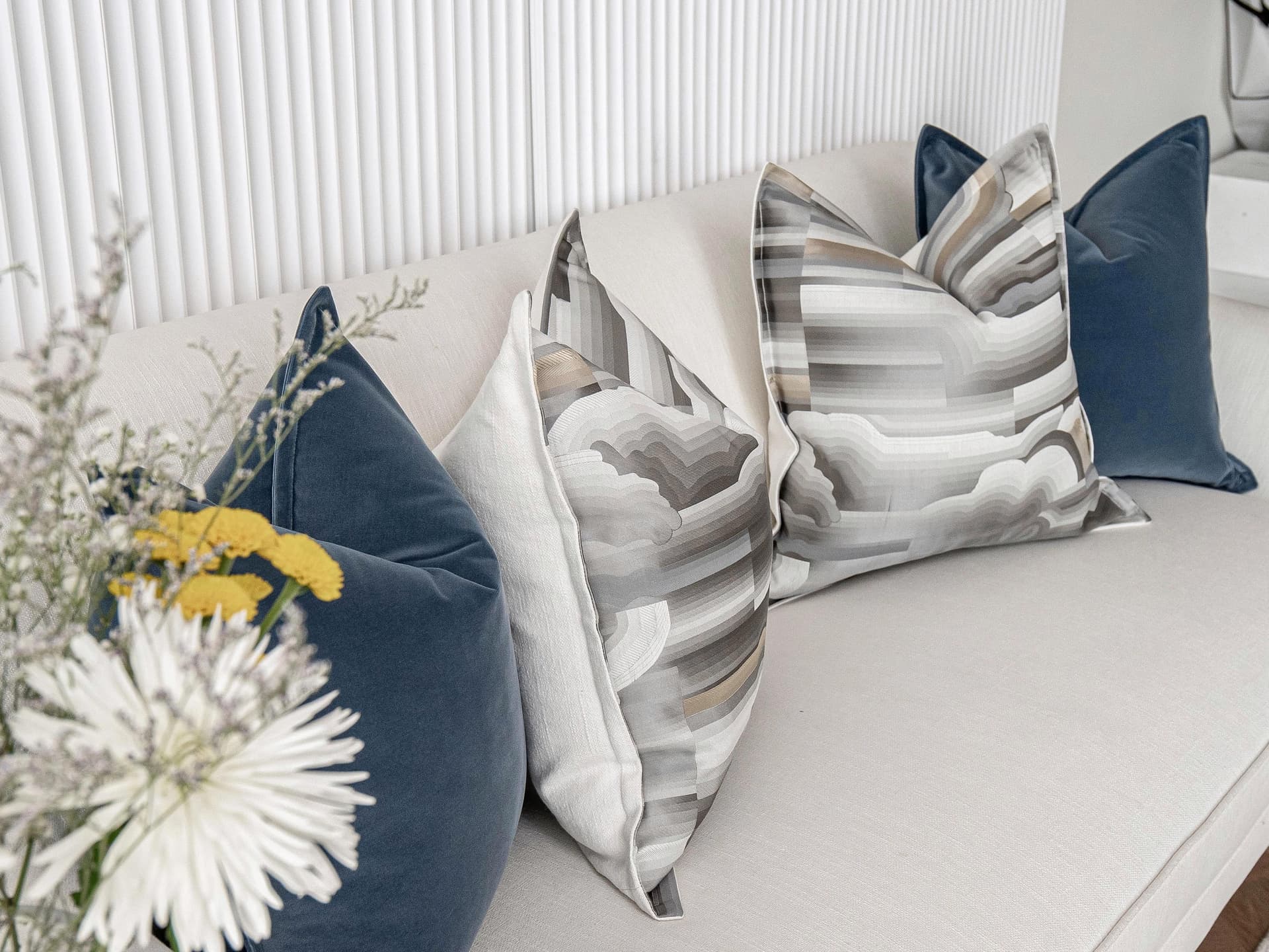 Guadalupe Bundle cushion in blue and grey, shown in a lifestyle left view as image 9