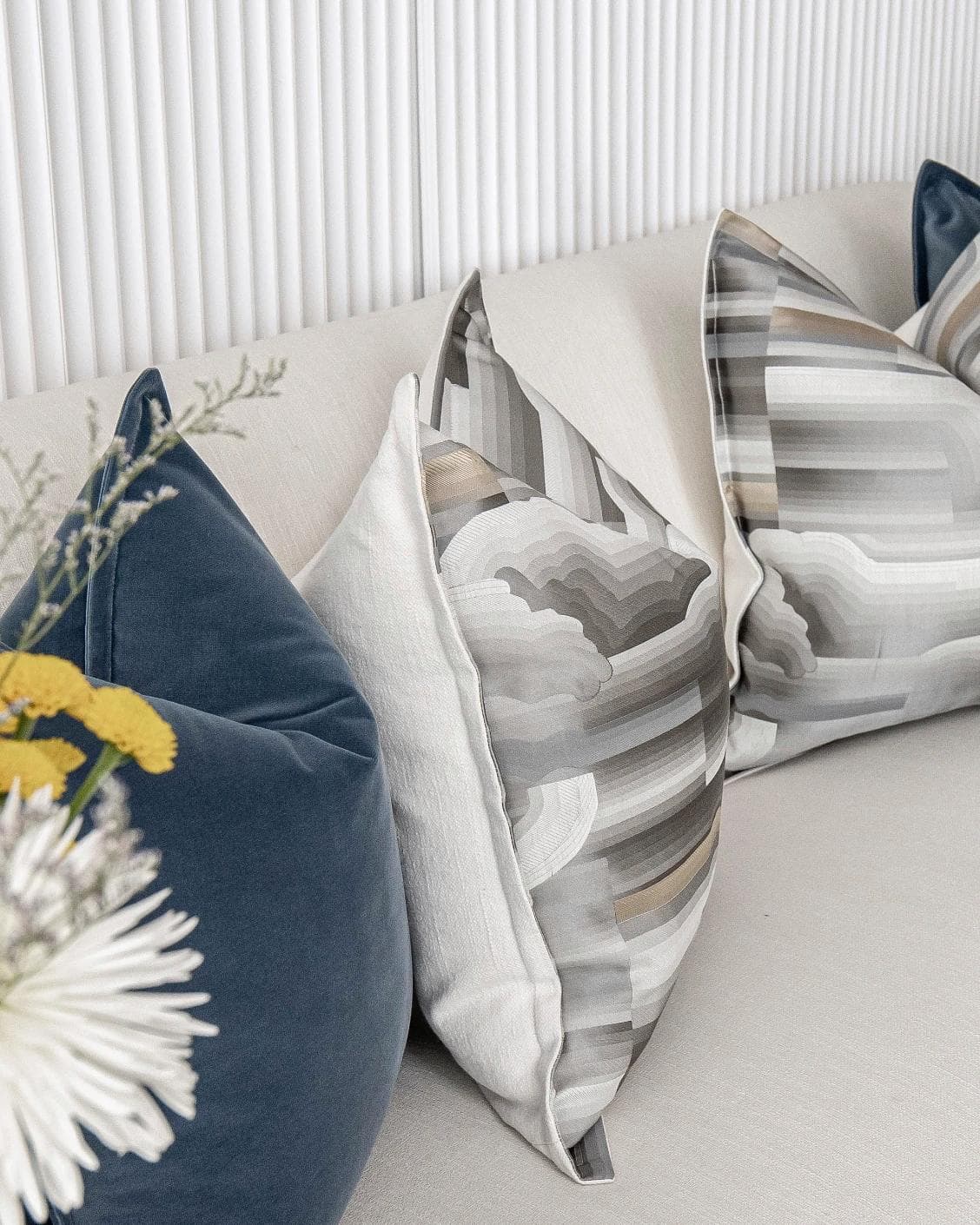 Guadalupe Bundle cushion in blue and grey, shown in a lifestyle left view as image 9