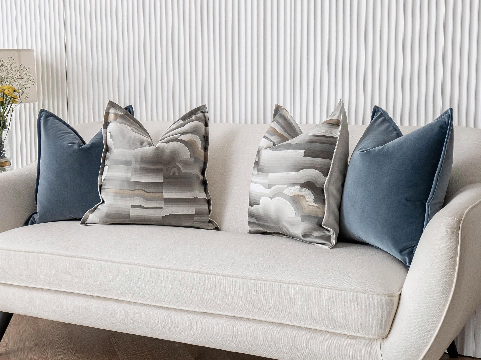 Guadalupe Bundle cushion in blue and grey, shown in a lifestyle right view as image 2