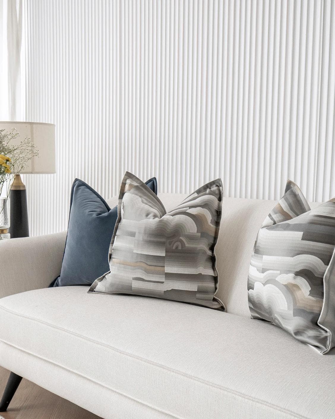 Guadalupe Bundle cushion in blue and grey, shown in a lifestyle right view as image 10