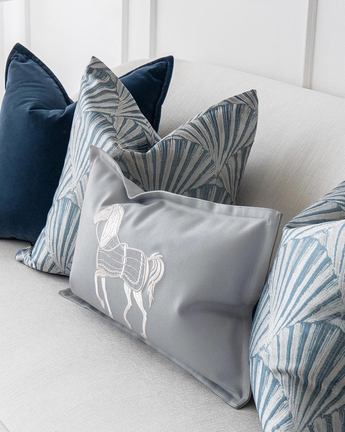 Remi Bundle cushion in blue, silver and white, shown in a product right view as image 5