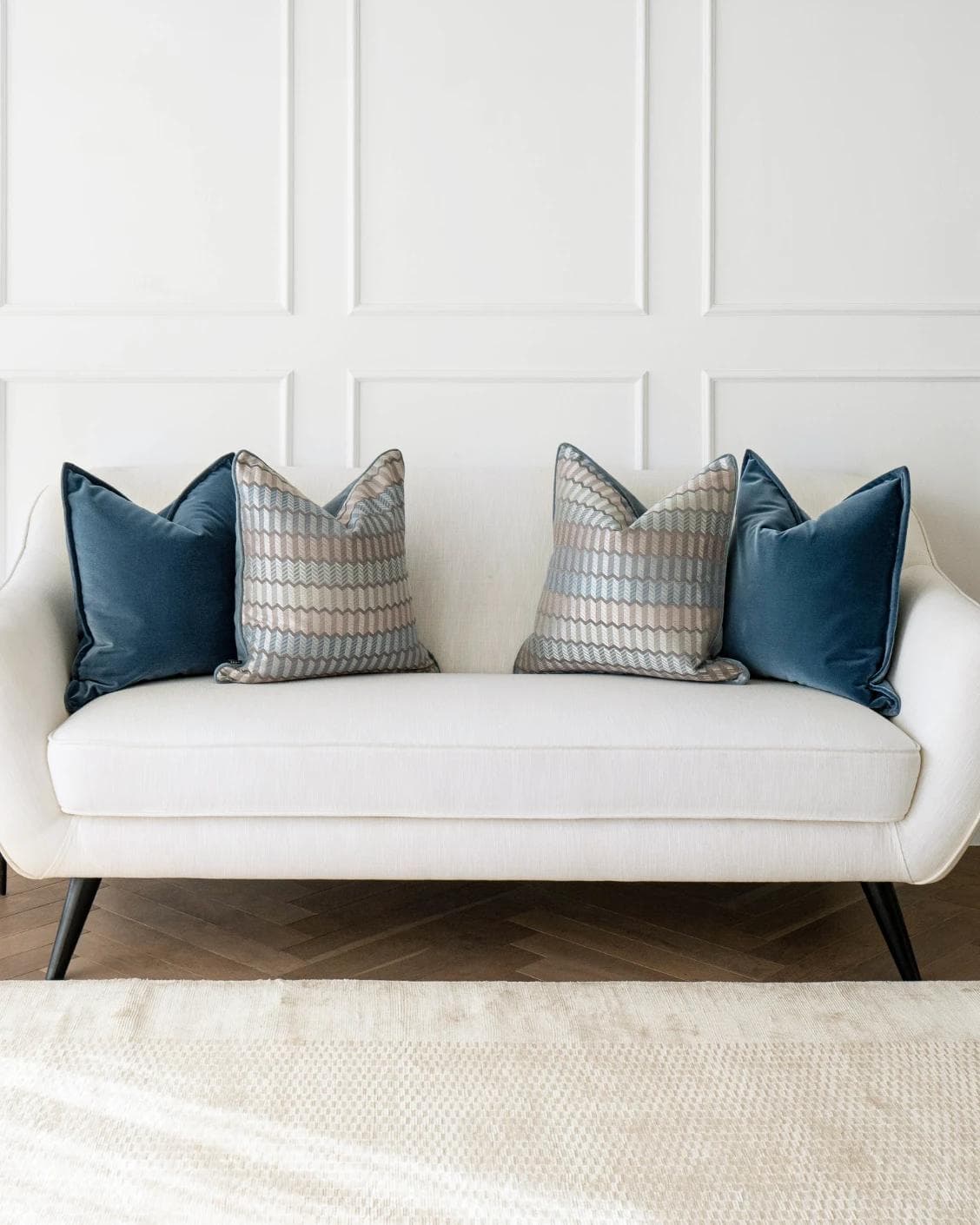Ivy Bundle cushion in blue and silver, shown in a lifestyle front view as image 4