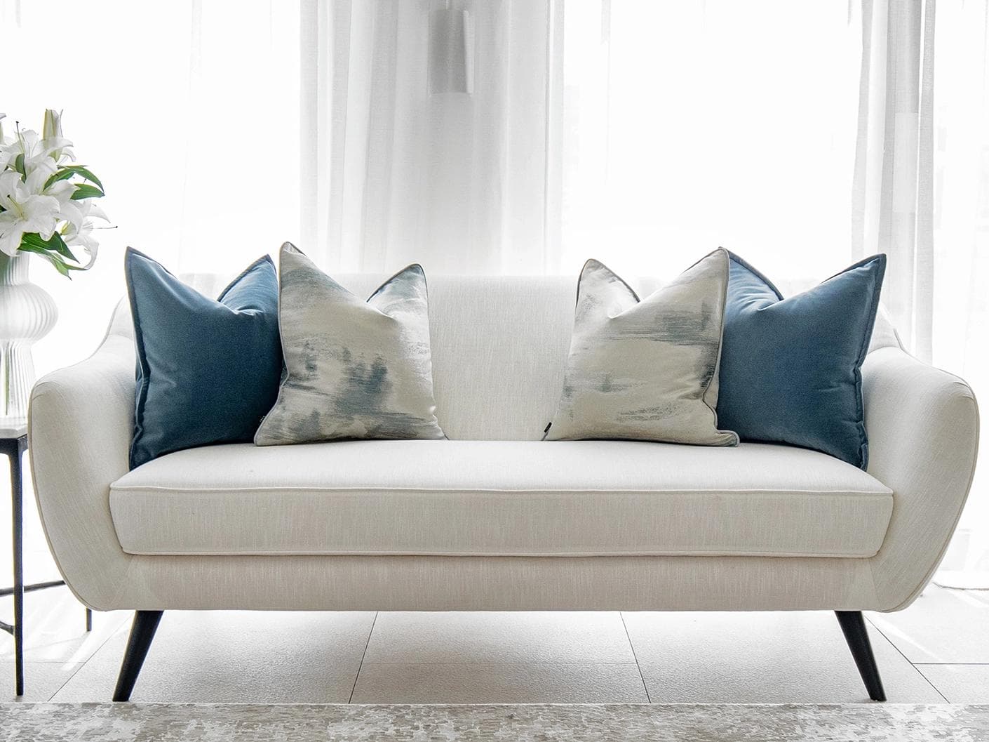 Francine Bundle cushion in blue and silver, shown in a lifestyle front view as image 4