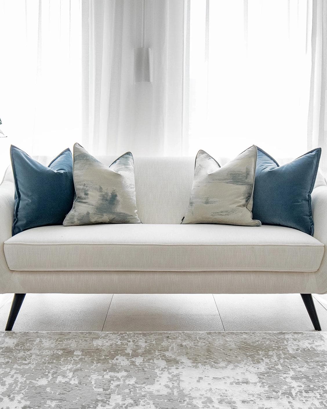 Francine Bundle cushion in blue and silver, shown in a lifestyle front view as image 4