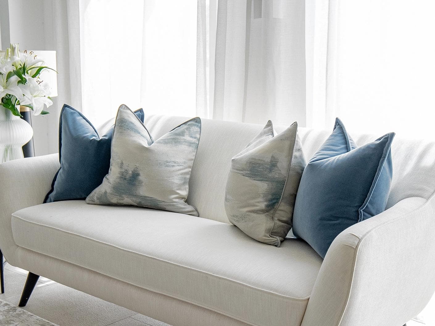 Francine Bundle cushion in blue and silver, shown in a lifestyle right view as image 2