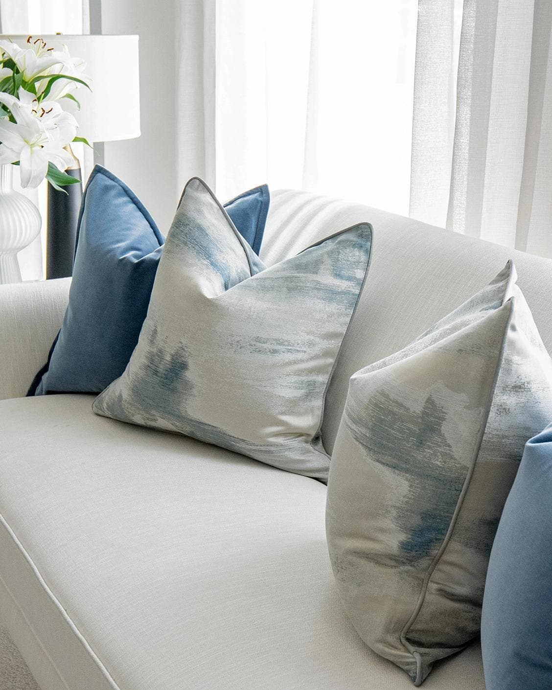 Francine Bundle cushion in blue and silver, shown in a lifestyle right view as image 5