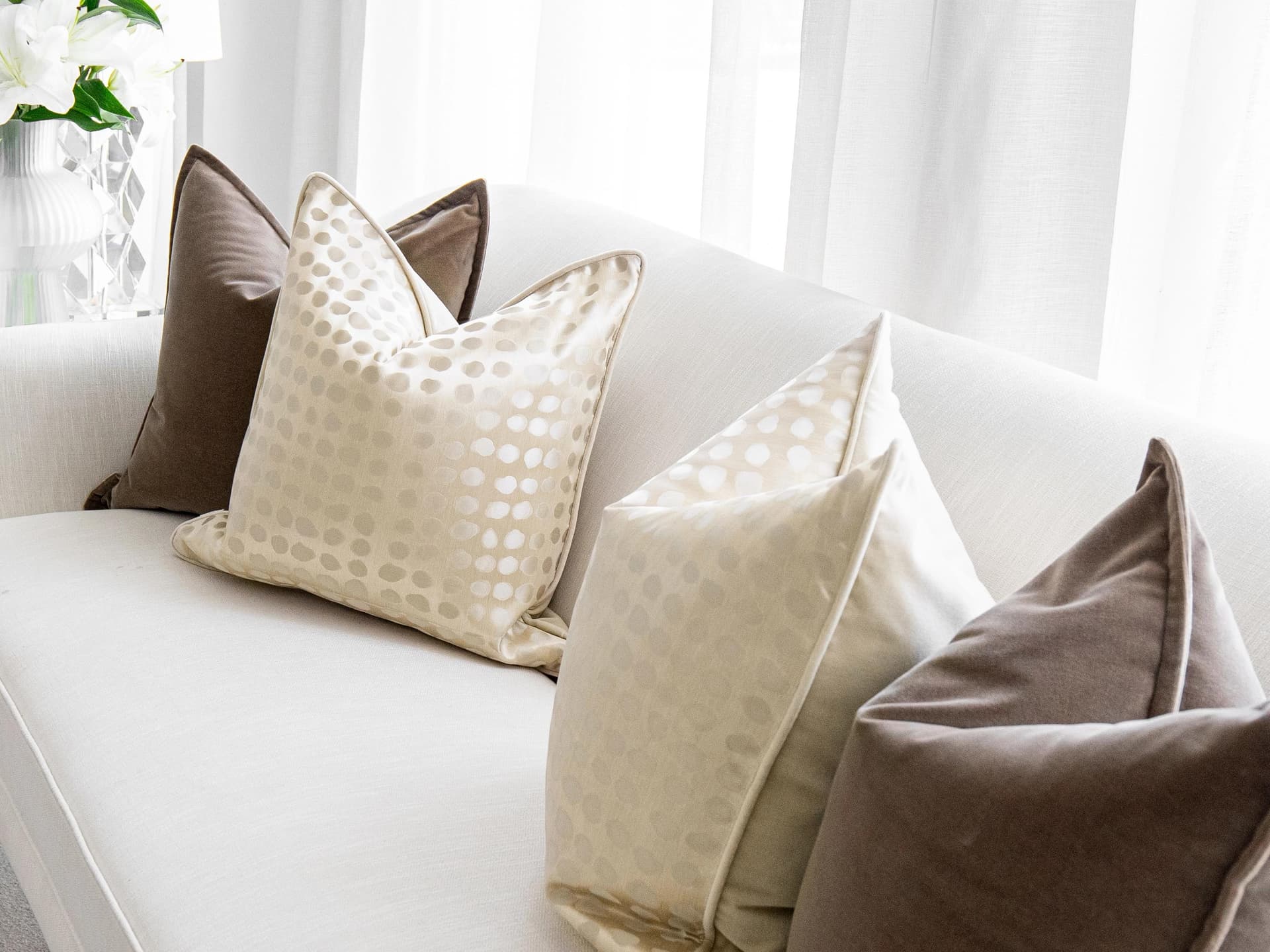 Flora Bundle cushion in brown, beige and gold, shown in a lifestyle right view as image 4