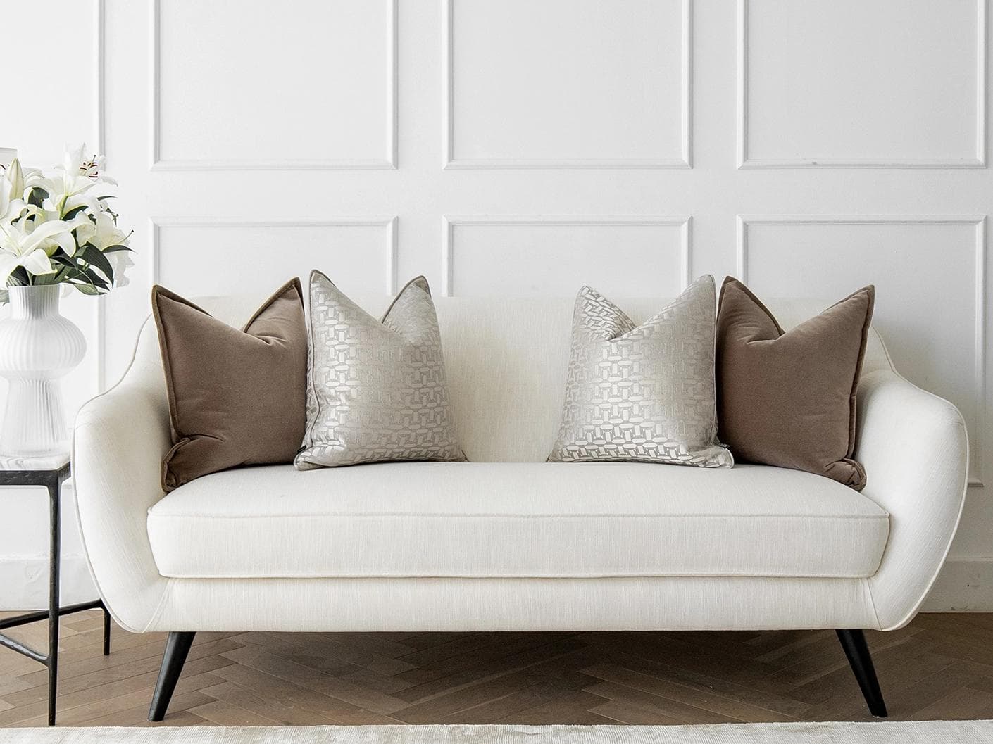 Elsie Bundle cushion in brown, beige and silver, shown in a lifestyle front view as image 4