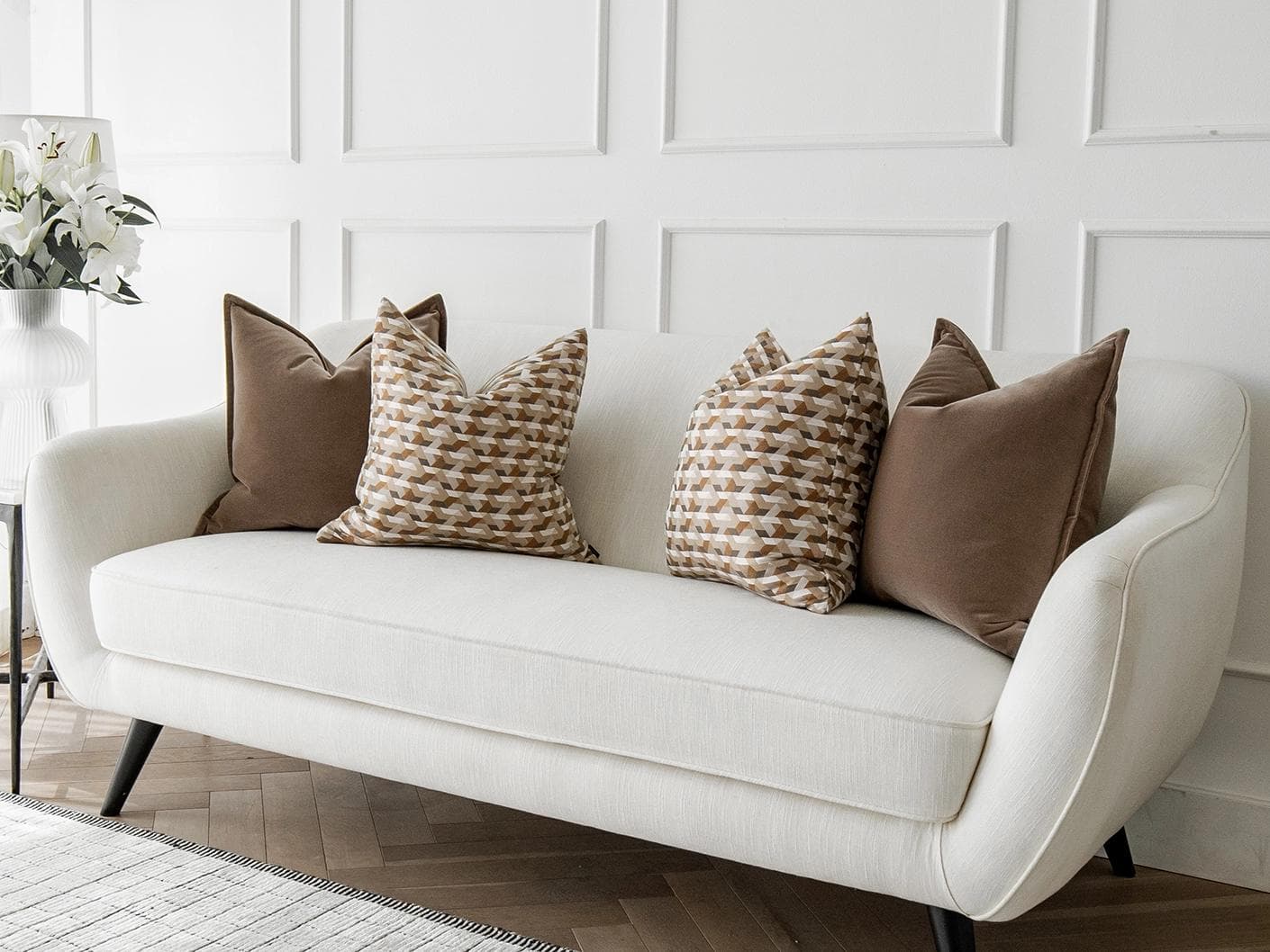 Marilyn Bundle cushion in brown, orange and beige, shown in a lifestyle right view as image 2