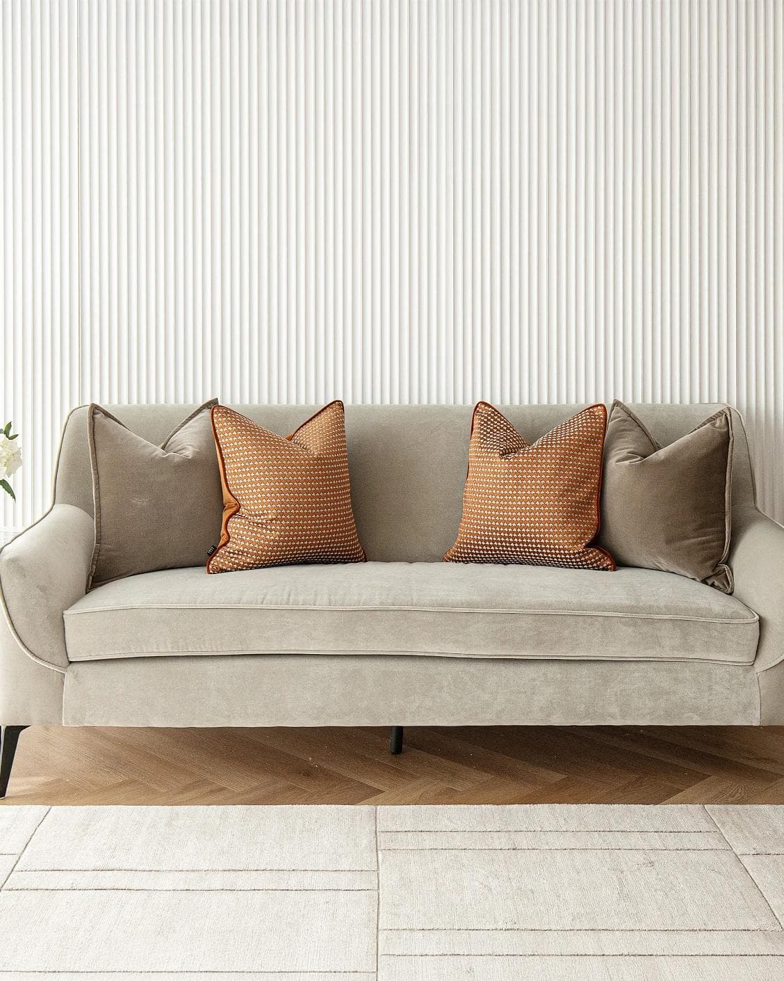 Kalysta Bundle cushion in brown and orange, shown in a lifestyle front view as image 4