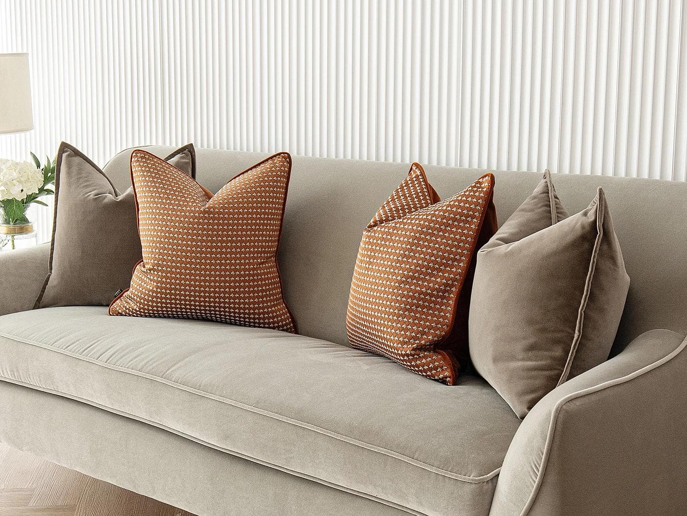 Kalysta Bundle cushion in brown and orange, shown in a lifestyle right view as image 2