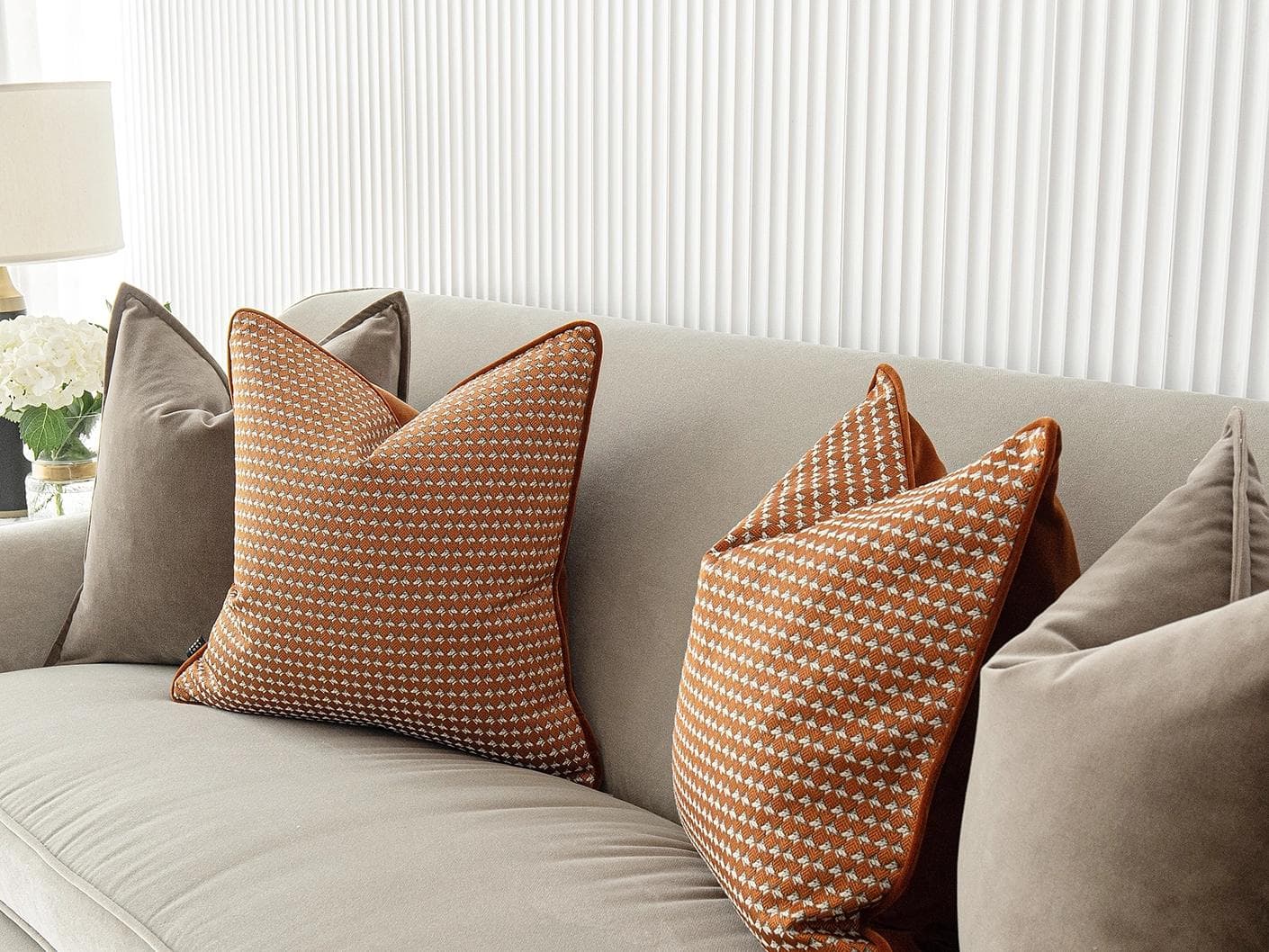 Kalysta Bundle cushion in brown and orange, shown in a lifestyle right view as image 5