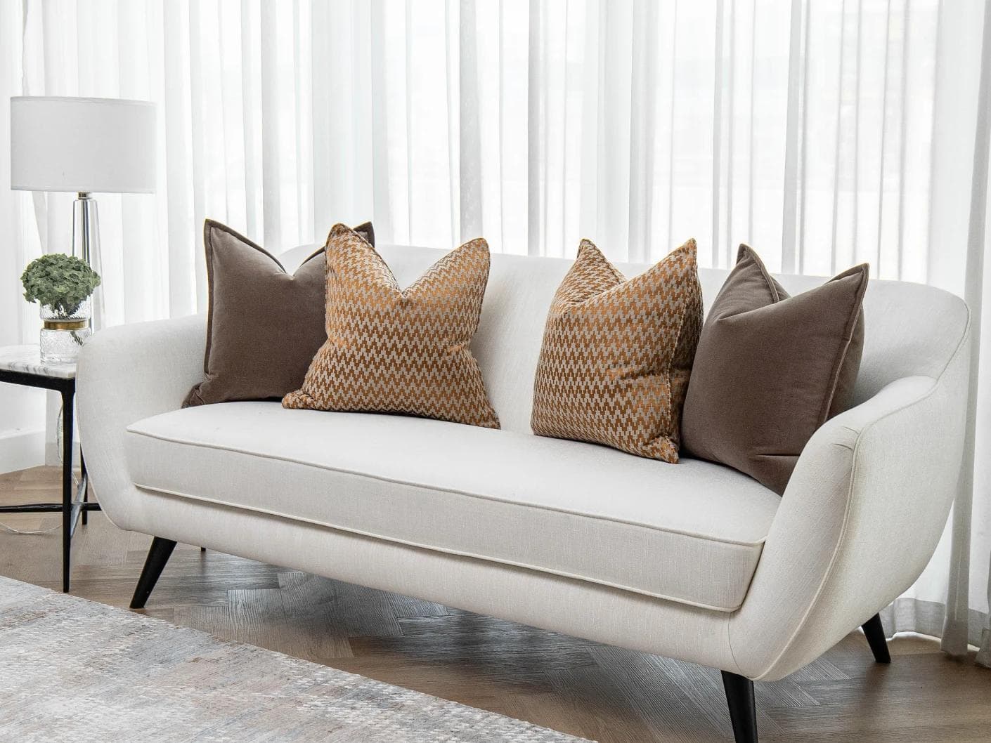 Vicente Bundle cushion in brown and orange, shown in a lifestyle right view as image 2