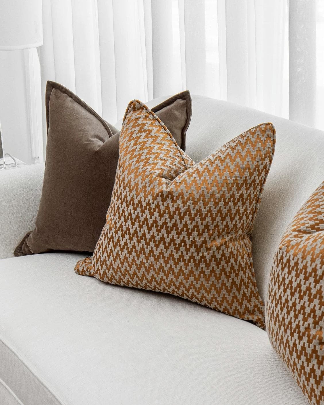 Vicente Bundle cushion in brown and orange, shown in a product right view as image 5
