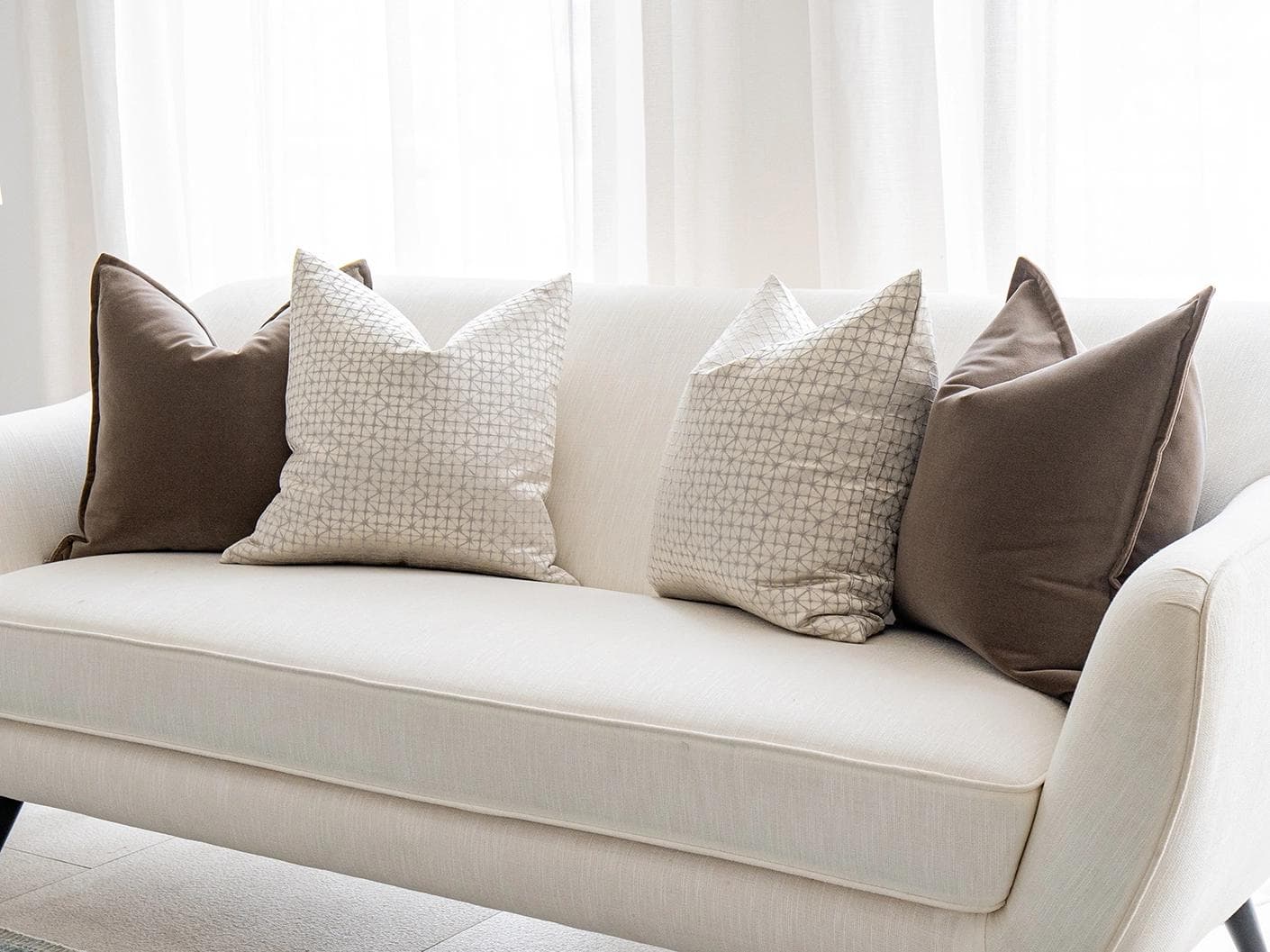 Farah Bundle cushion in brown and silver, shown in a lifestyle right view as image 2