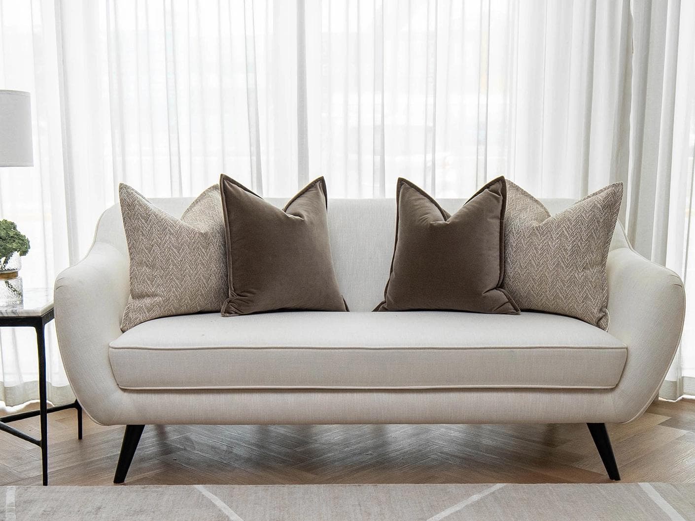 Fernando Bundle cushion in brown and beige, shown in a lifestyle front view as image 4