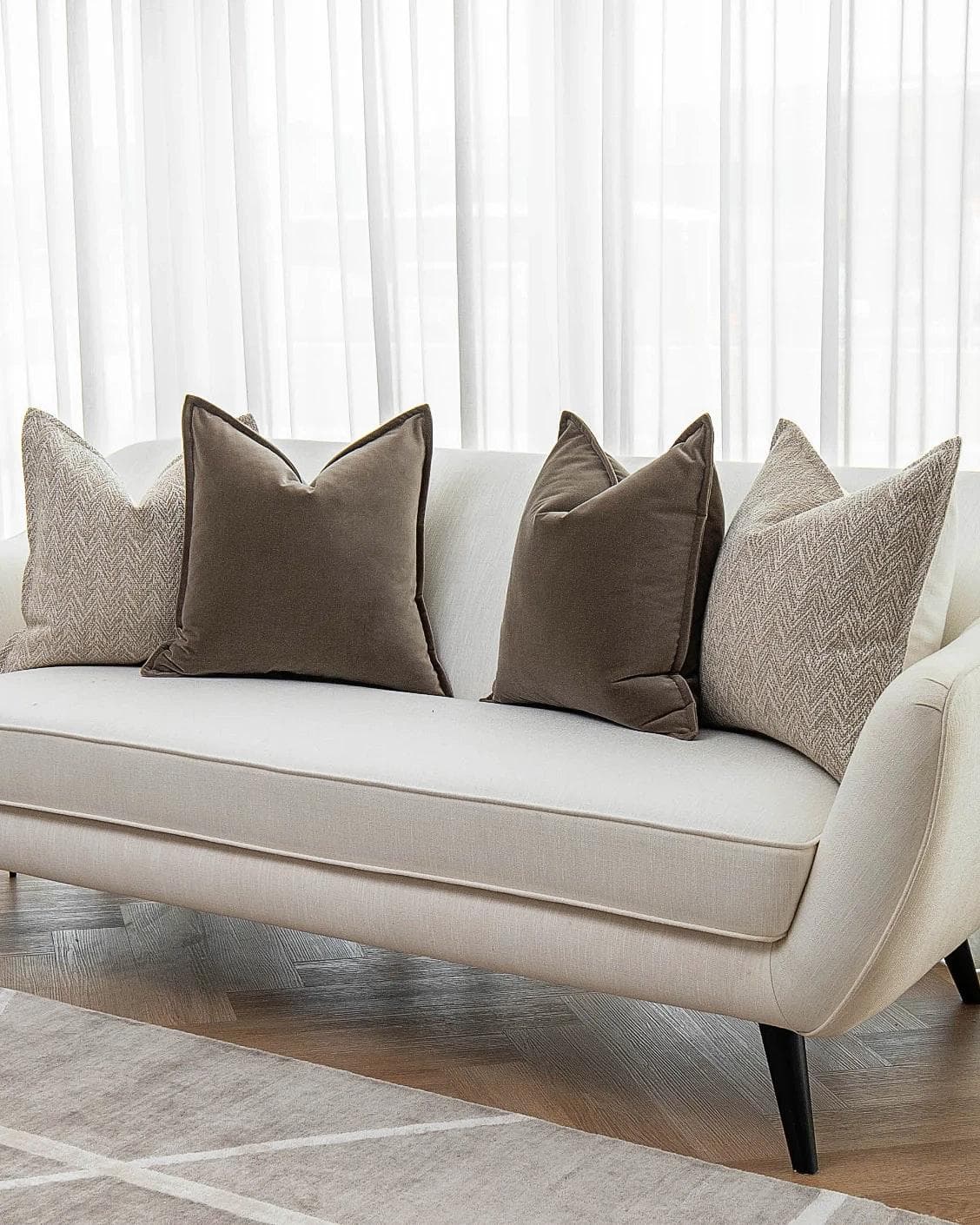 Fernando Bundle cushion in brown and beige, shown in a lifestyle right view as image 2