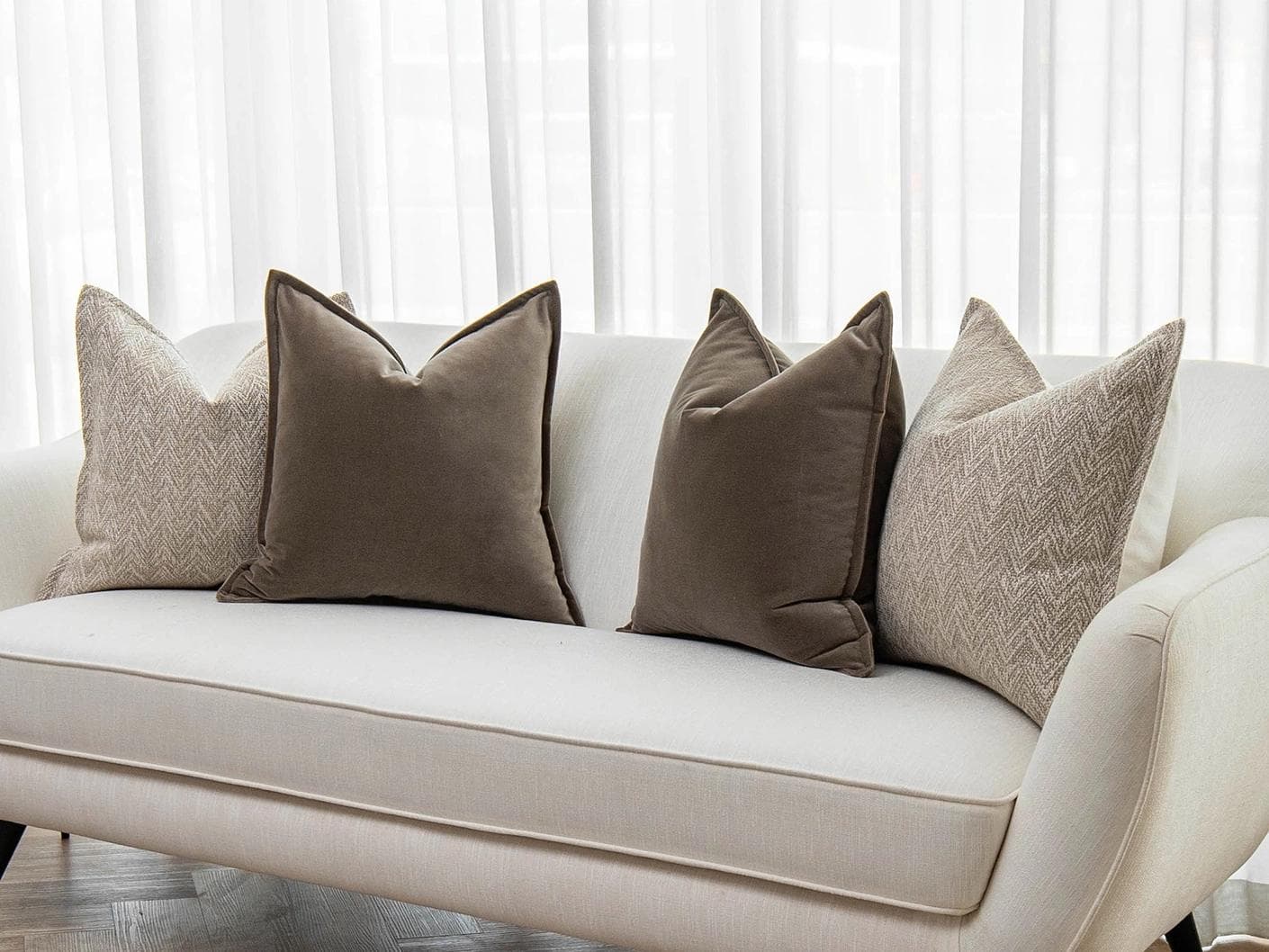 Fernando Bundle cushion in brown and beige, shown in a lifestyle right view as image 2
