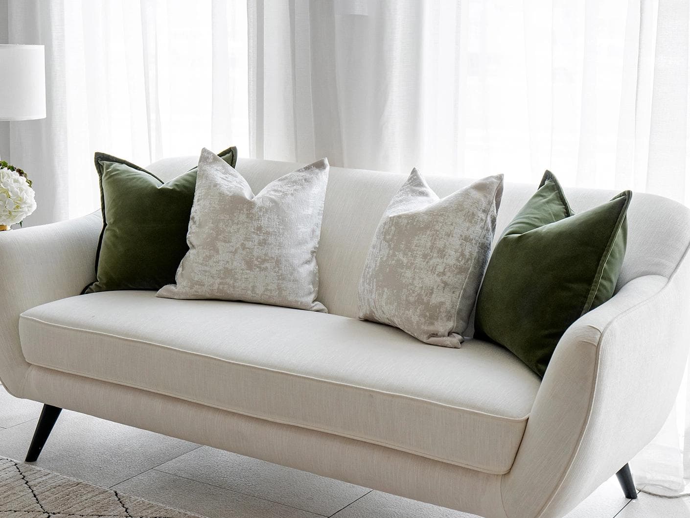 Jayce Bundle cushion in forest green, silver, grey and green, shown in a lifestyle right view as image 2