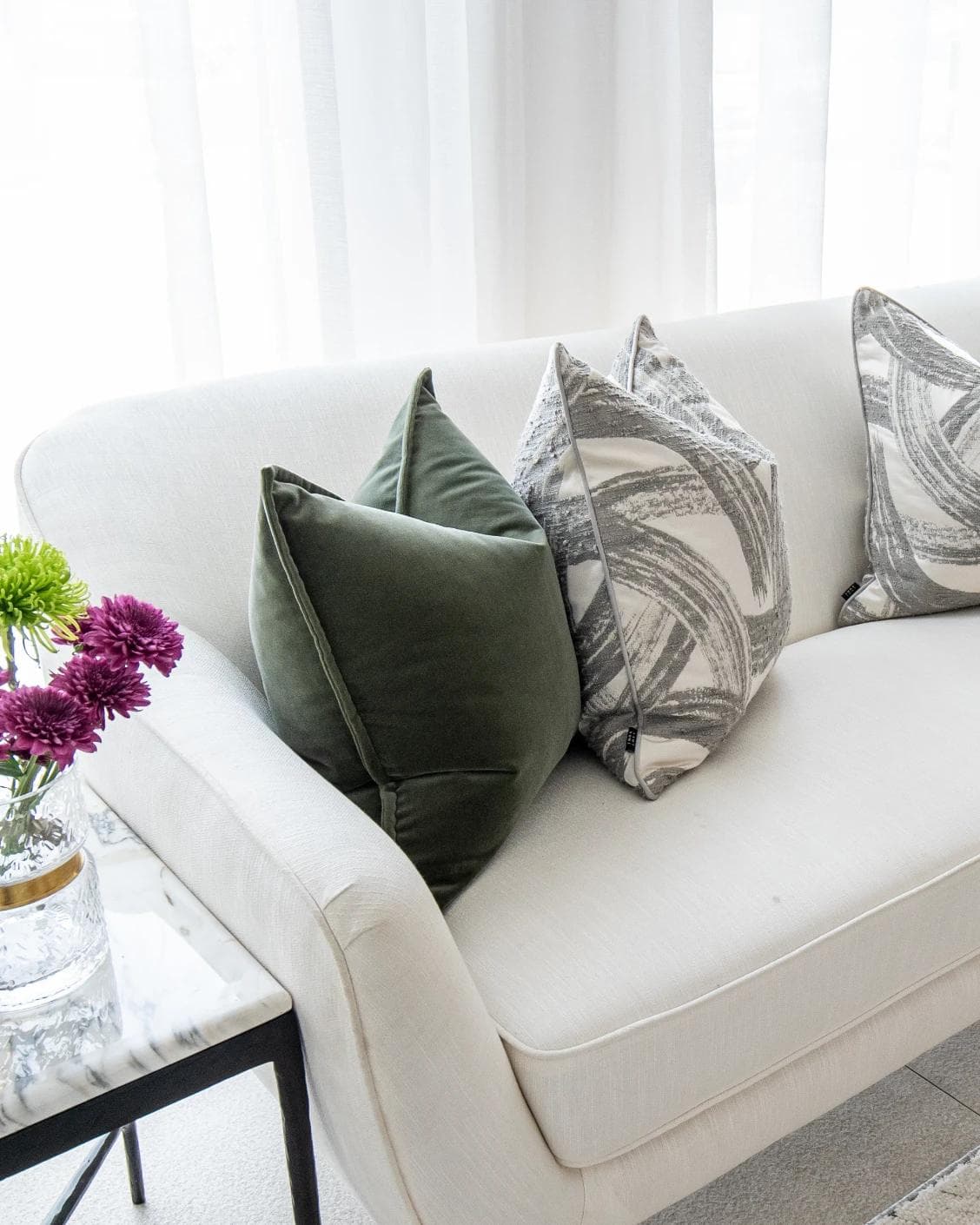 Cattleya Bundle cushion in green, white and grey, shown in a lifestyle left view as image 4