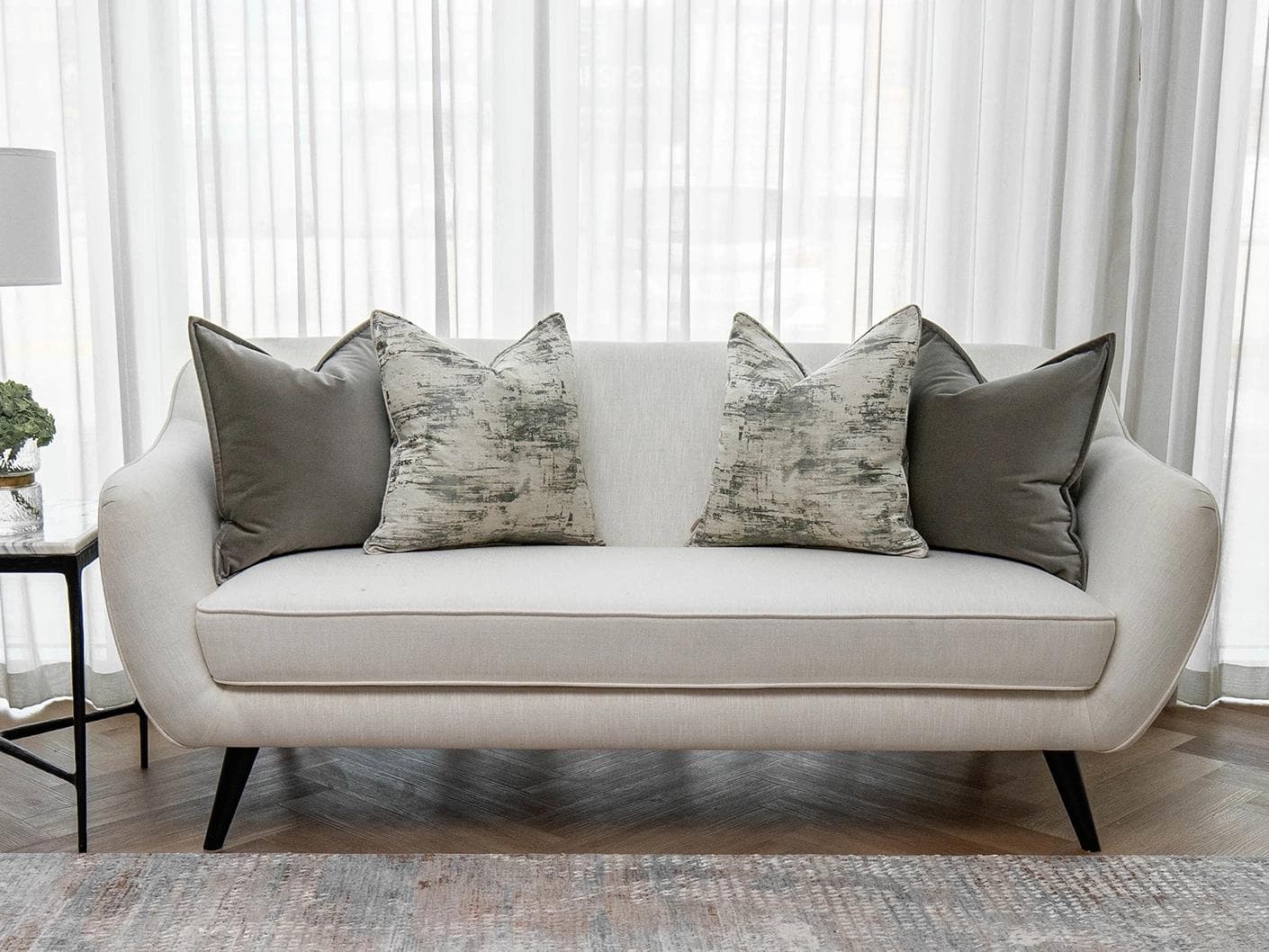 Mylene Bundle cushion in grey and white, shown in a lifestyle front view as image 4