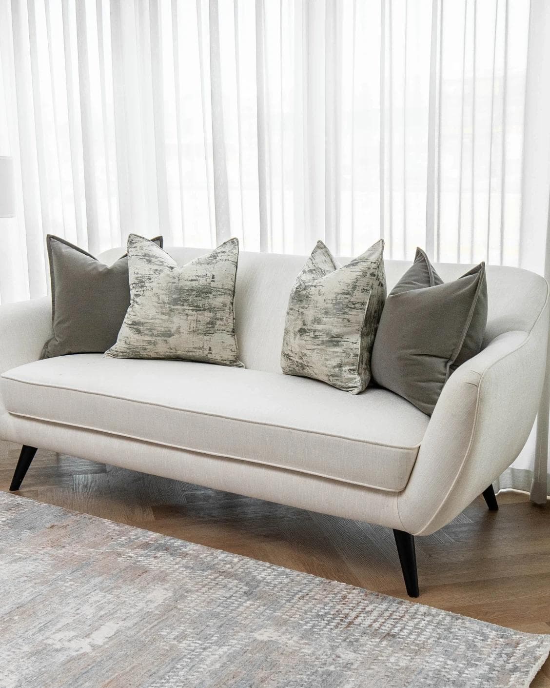 Mylene Bundle cushion in grey and white, shown in a lifestyle right view as image 2