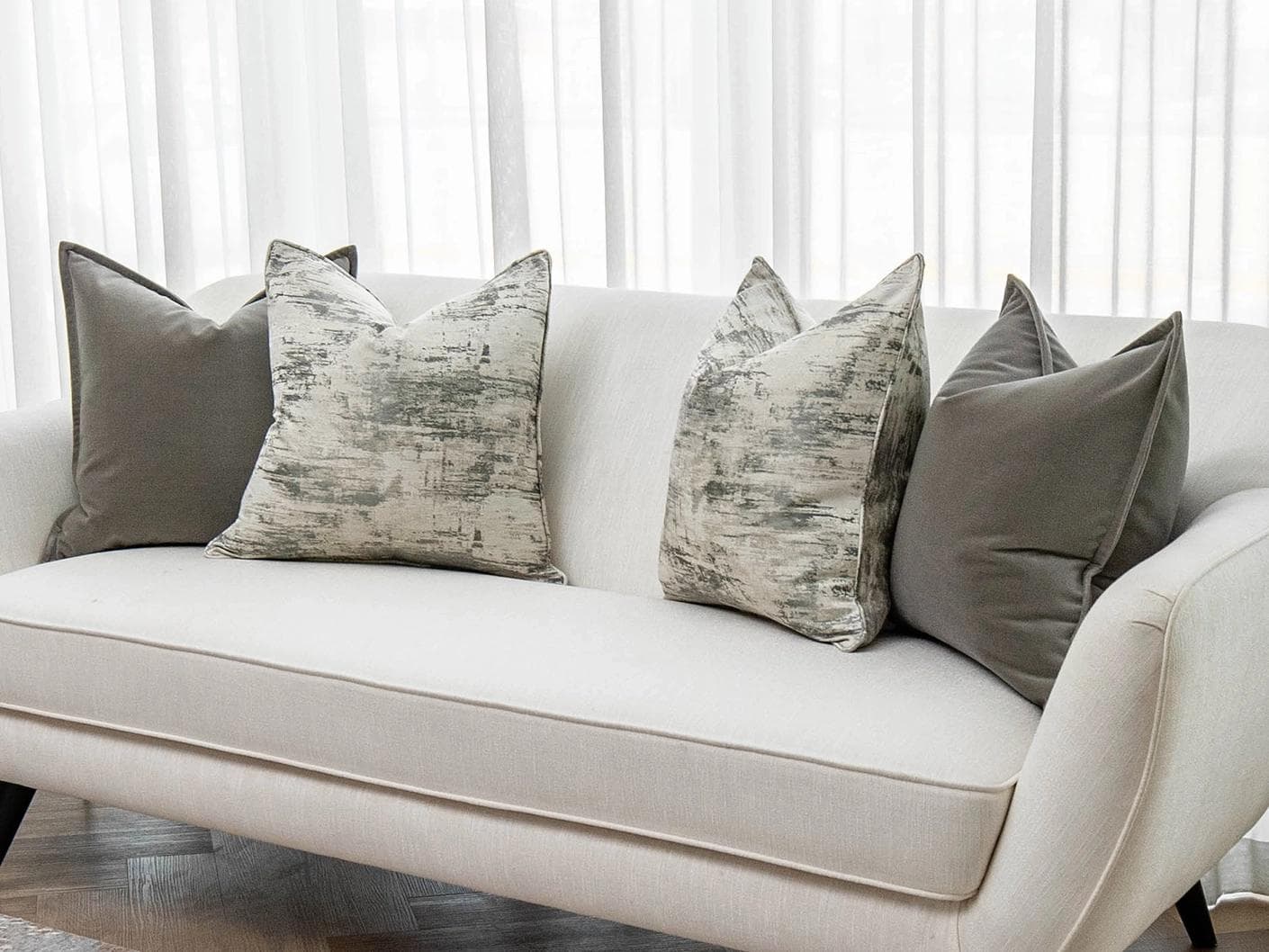 Mylene Bundle cushion in grey and white, shown in a lifestyle right view as image 2