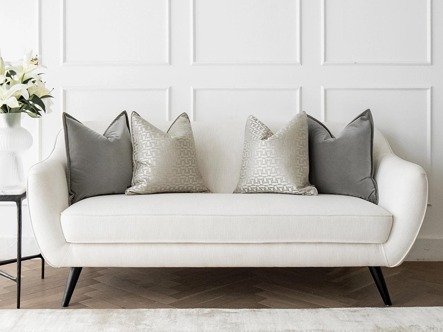 Amara Bundle cushion in grey, beige and silver, shown in a lifestyle front view as image 4