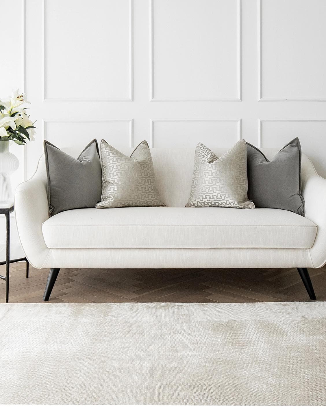 Amara Bundle cushion in grey, beige and silver, shown in a lifestyle front view as image 4