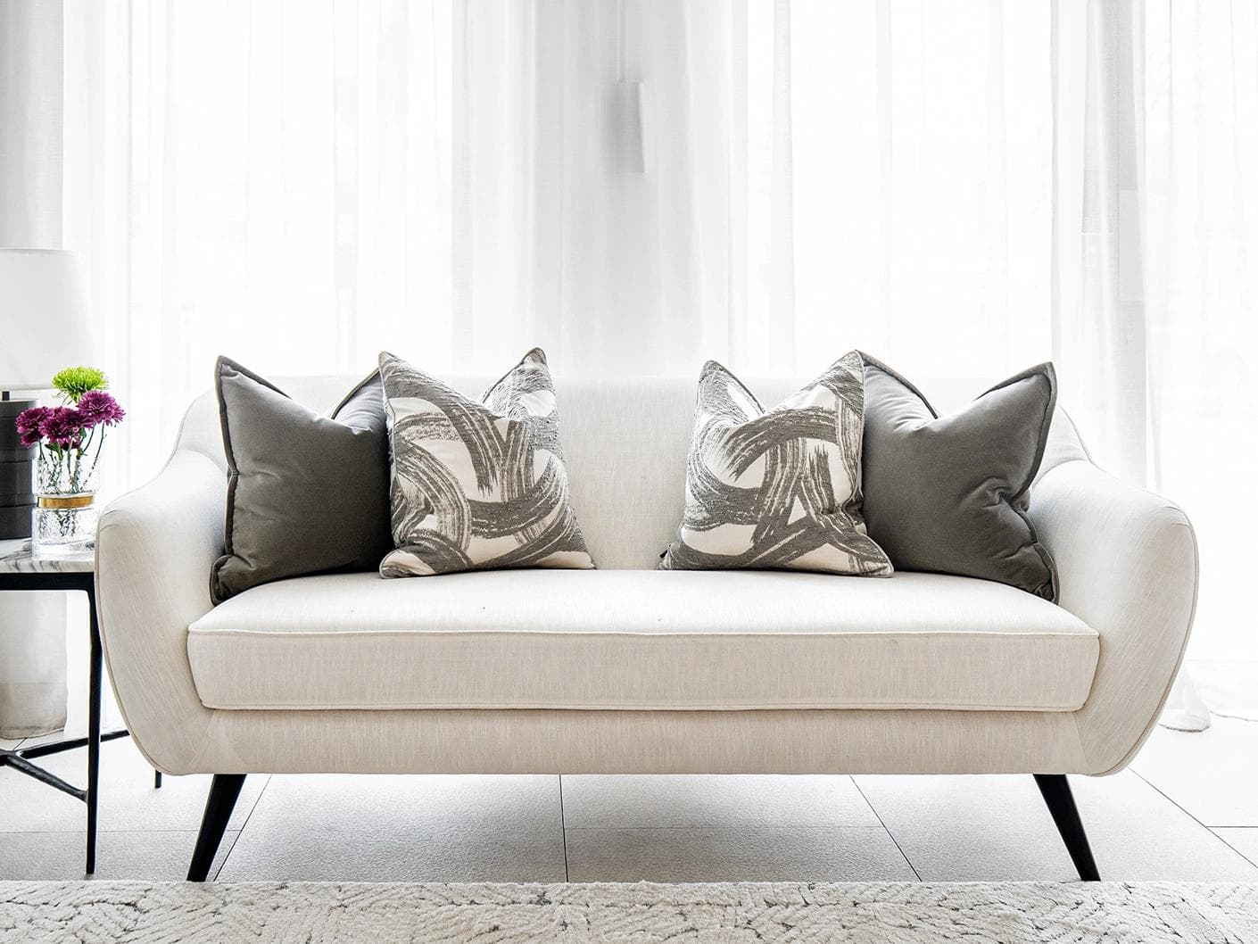Lilian Bundle cushion in grey and white, shown in a lifestyle front view as image 4