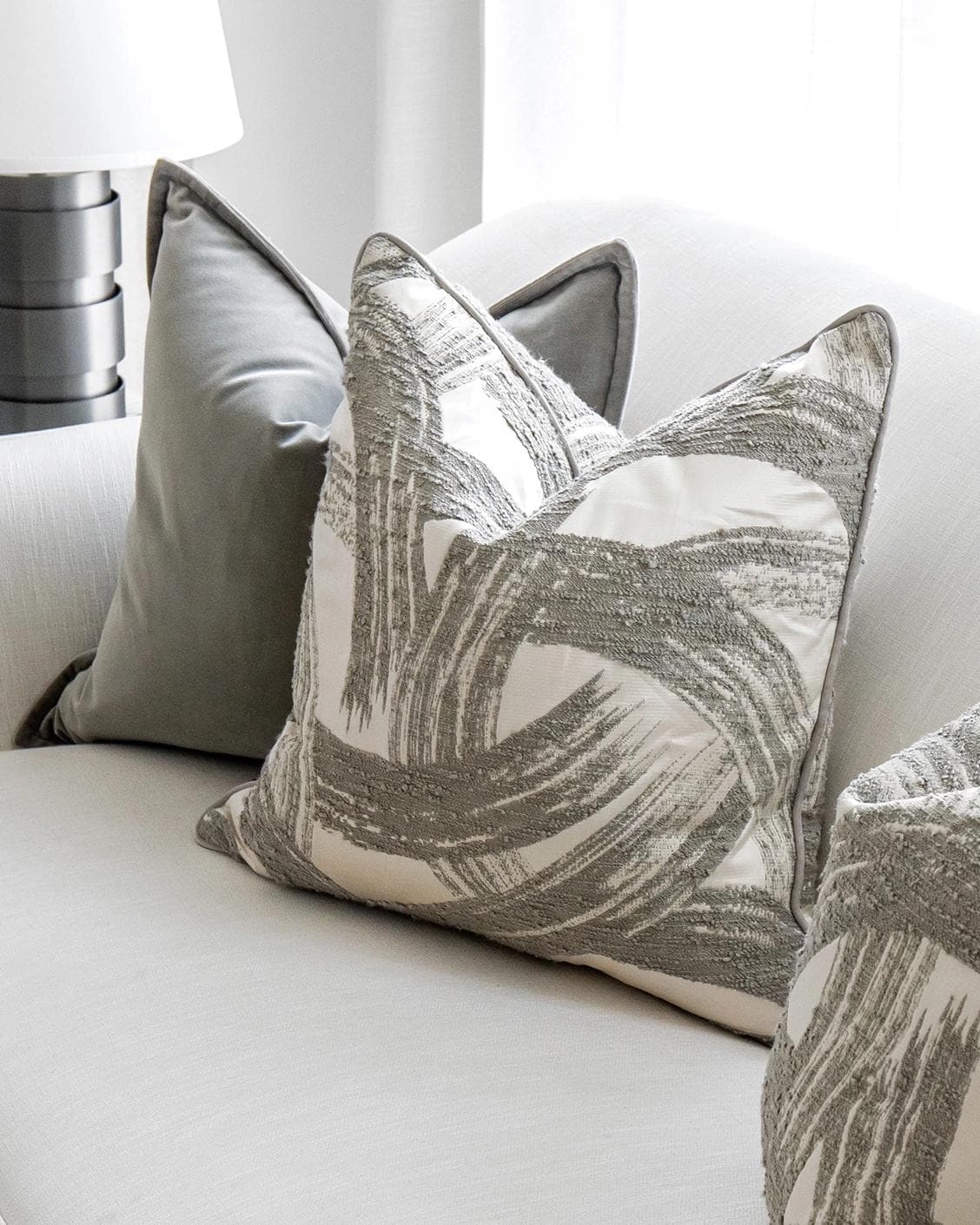 Lilian Bundle cushion in grey and white, shown in a lifestyle top view as image 5