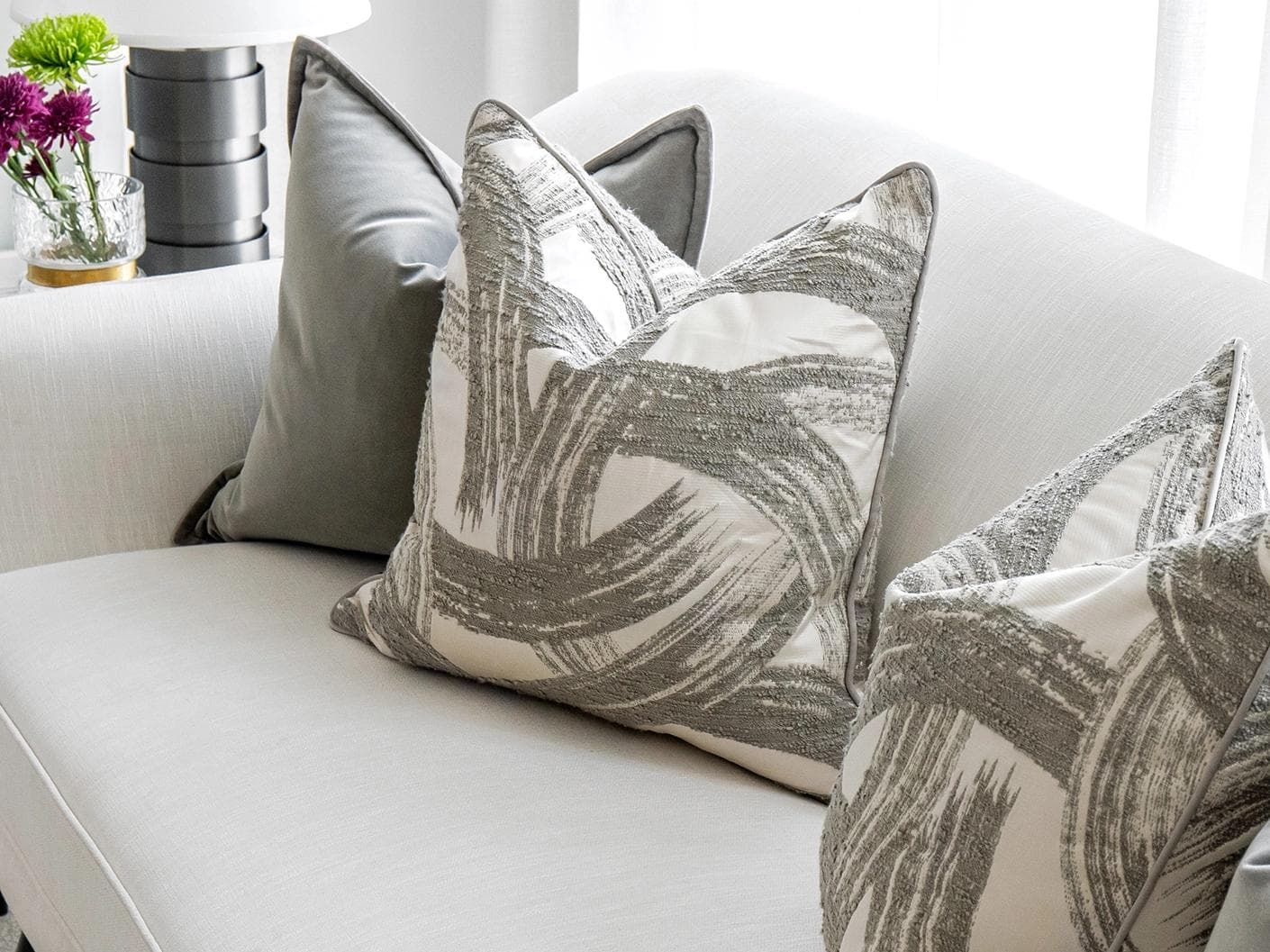 Lilian Bundle cushion in grey and white, shown in a lifestyle top view as image 5