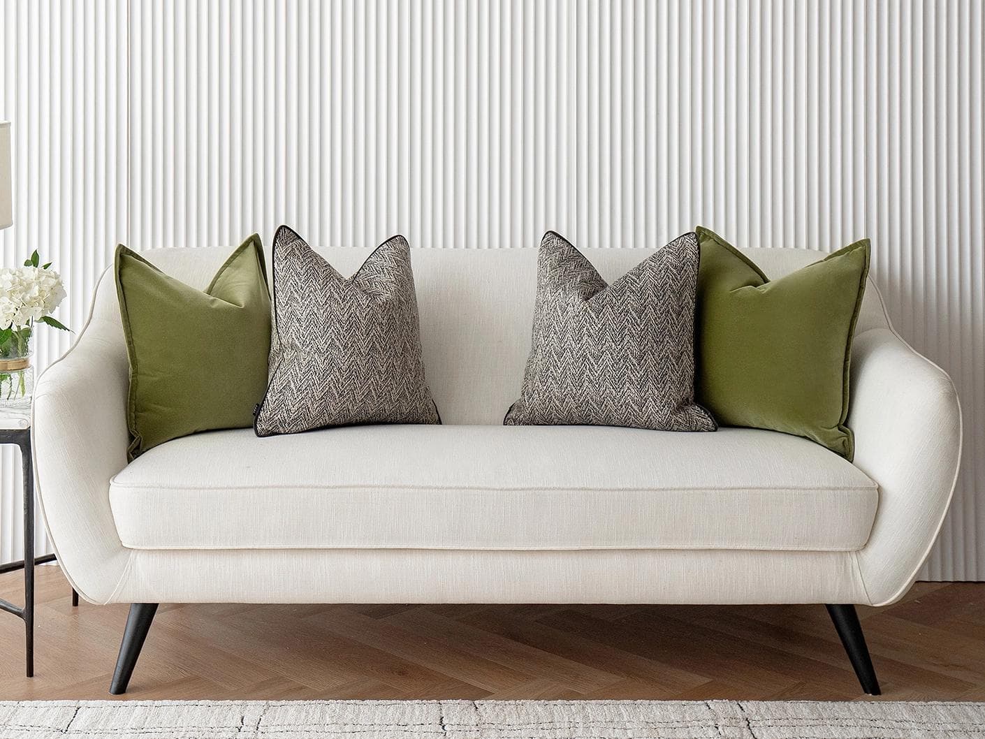 Maribel Bundle cushion in black, white and green, shown in a lifestyle front view as image 2